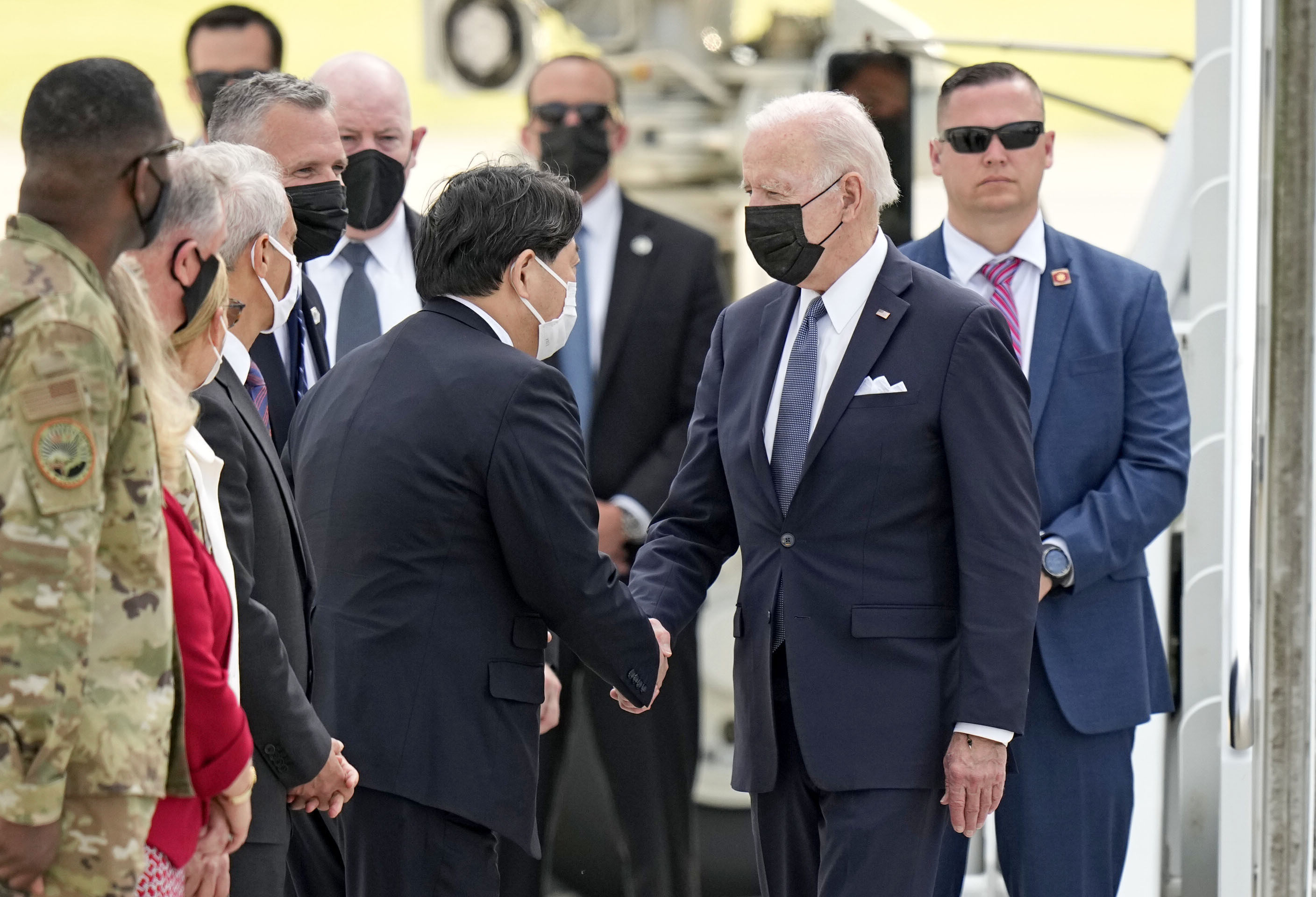 Japanese Foreign Minister Yoshimasa Hayashi greets US President Joe Biden at the US Yokota Air Base in the suburbs of Tokyo on Sunday. Photo: Kyoto
