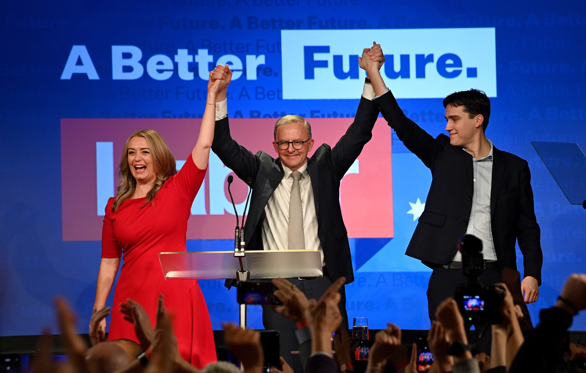 Australia’s new Prime Minister Anthony Albanese (centre) celebrates his election win with partner Jodie Haydon and son Nathan Albanese in Sydney, Australia, on May 21. Photo: EPA-EFE