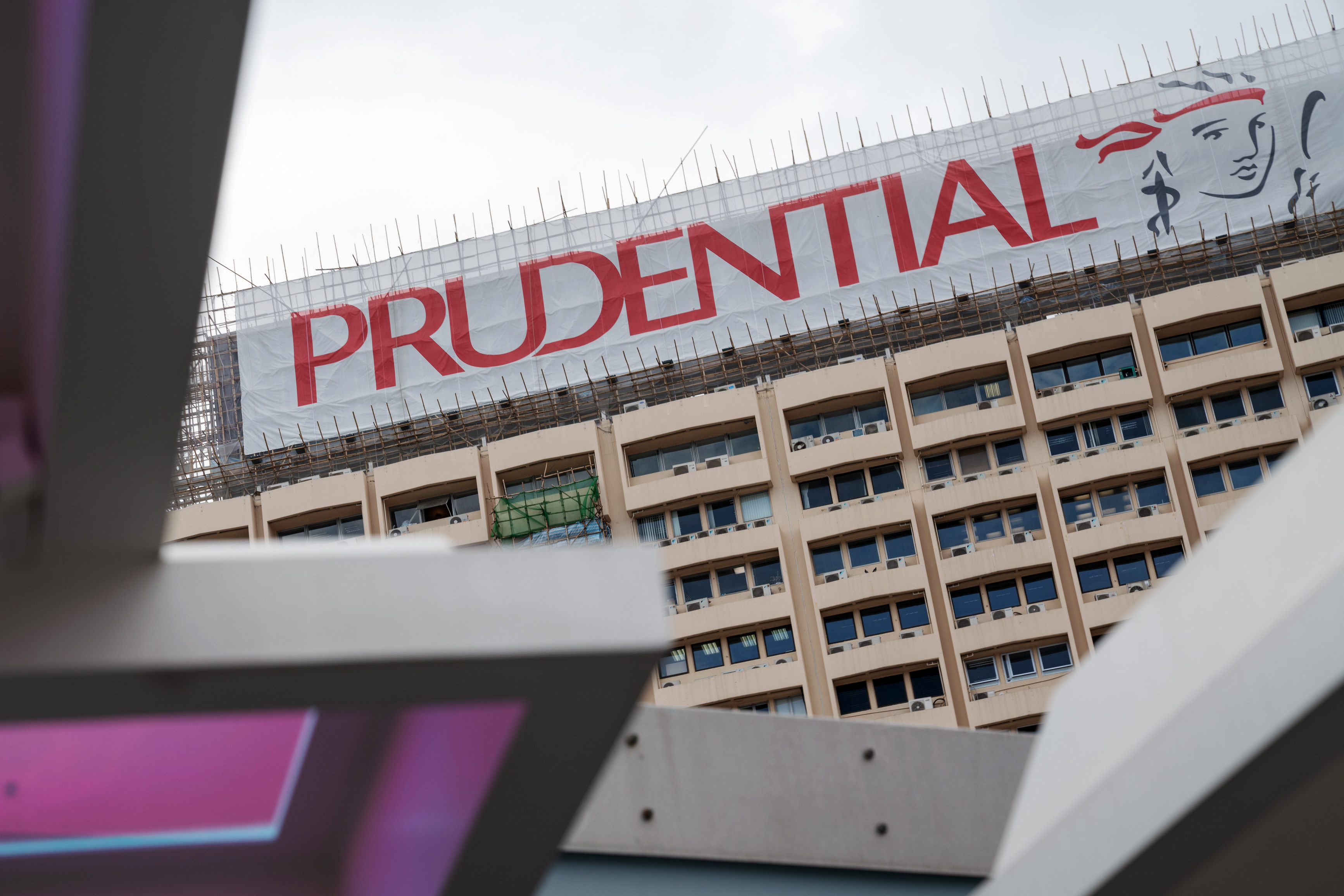 A banner featuring the Prudential logo is displayed atop a building in Hong Kong, in 2018. Photo: Bloomberg