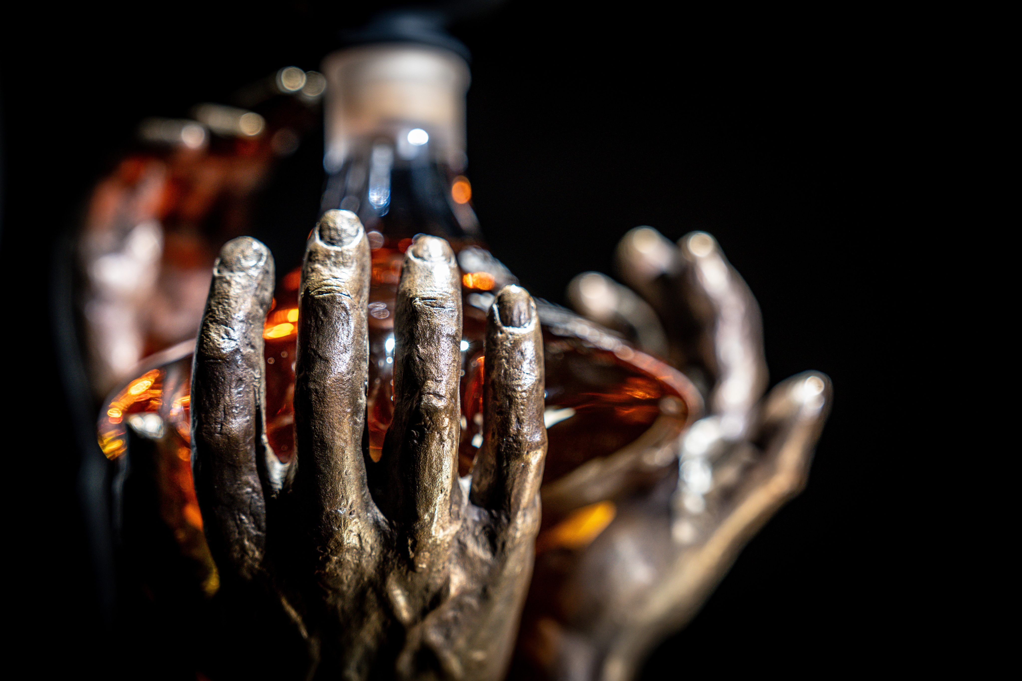 The bronze hands that hold The Reach were created by Scottish sculptor Saskia Robinson, and represent the whisky’s journey from World War II to the present day. Photo: The Macallan
