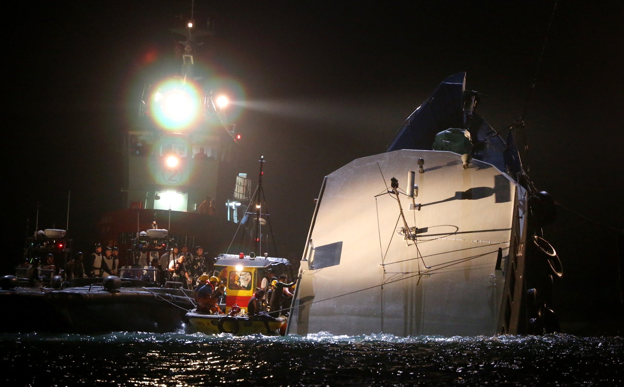 Rescuers beside Lamma IV after it collided with Sea Smooth. Photo: Sam Tsang
