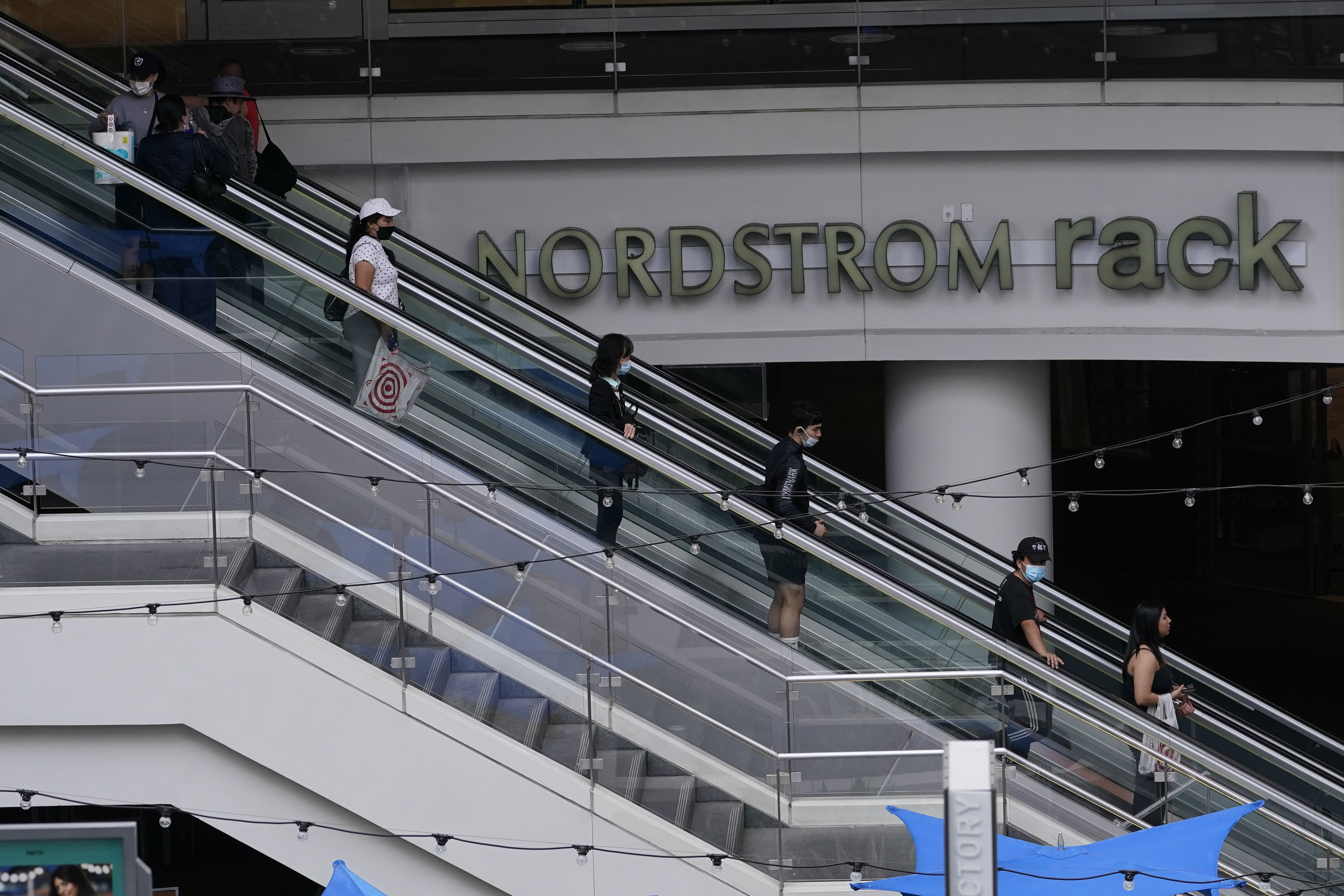 People shop at the Nordstrom Local DTLA in downtown Los Angeles on March 15. Some economists point to the decline in consumer confidence, to levels not seen in years, as evidence that higher prices are taking their toll. Photo: AP