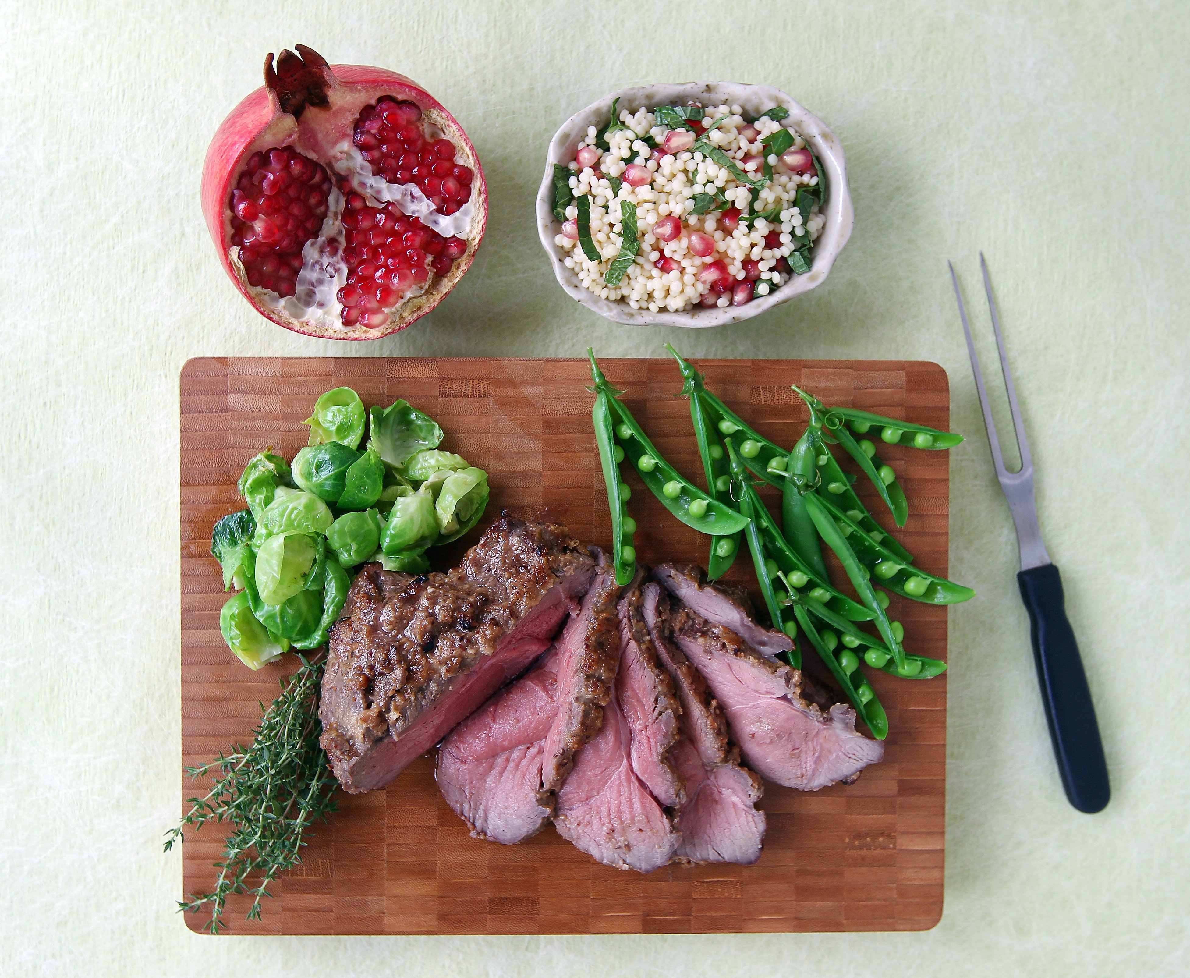 Butterflied leg of lamb is a delicious summer dish that’s quite quick to cook after the meat has sat in a thyme-flavoured marinade. Serve it with sides of pearl couscous with lemon, Parmesan and mint, and stir-fried sugar peas and Brussels sprouts. Photo: Jonathan Wong