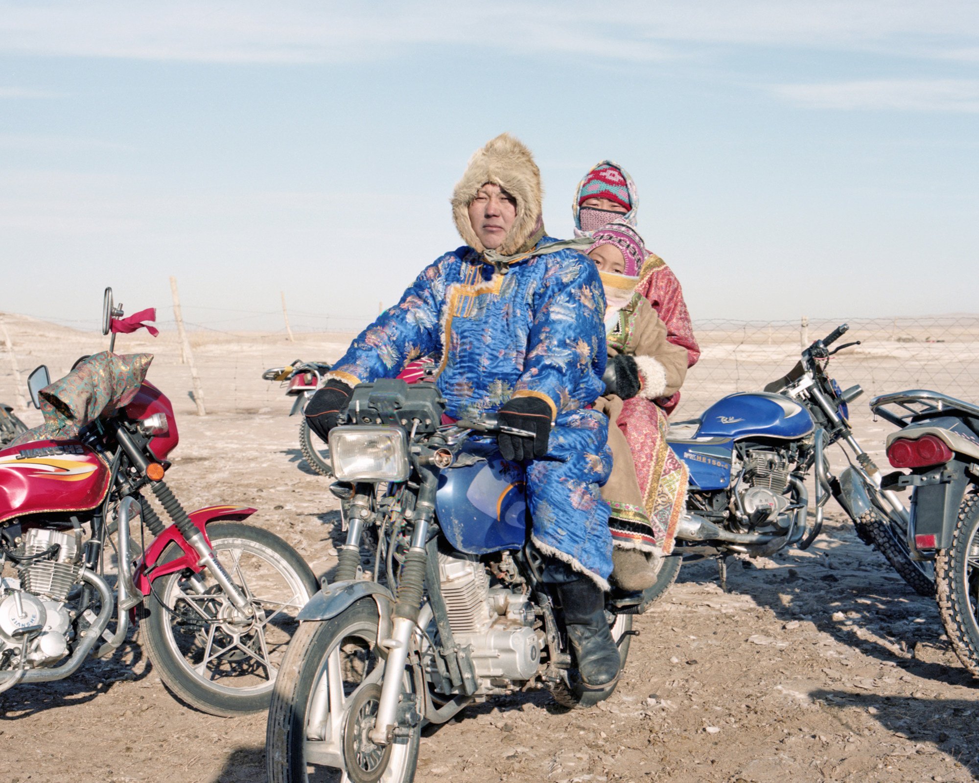 A family rides a motorcycle in Xiwu Banner in 2008. Photo: Li Wei