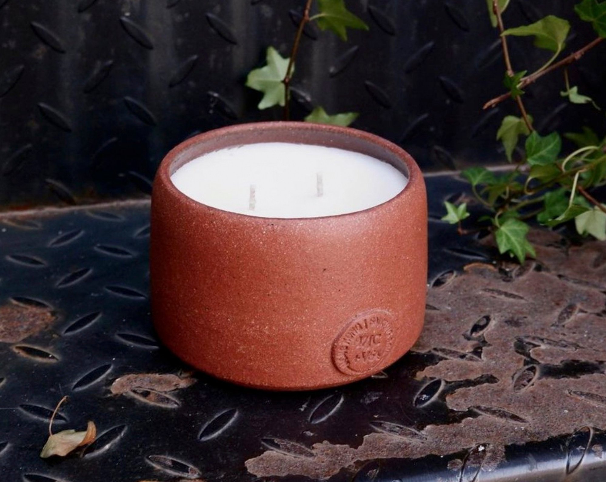 One of the 200 candles in terracotta-style pots produced for the Our Land project, a collaboration between BeCandle, designer Niko Leung and potter Candy Law. Photo: courtesy Instagram/@becandle_saikung