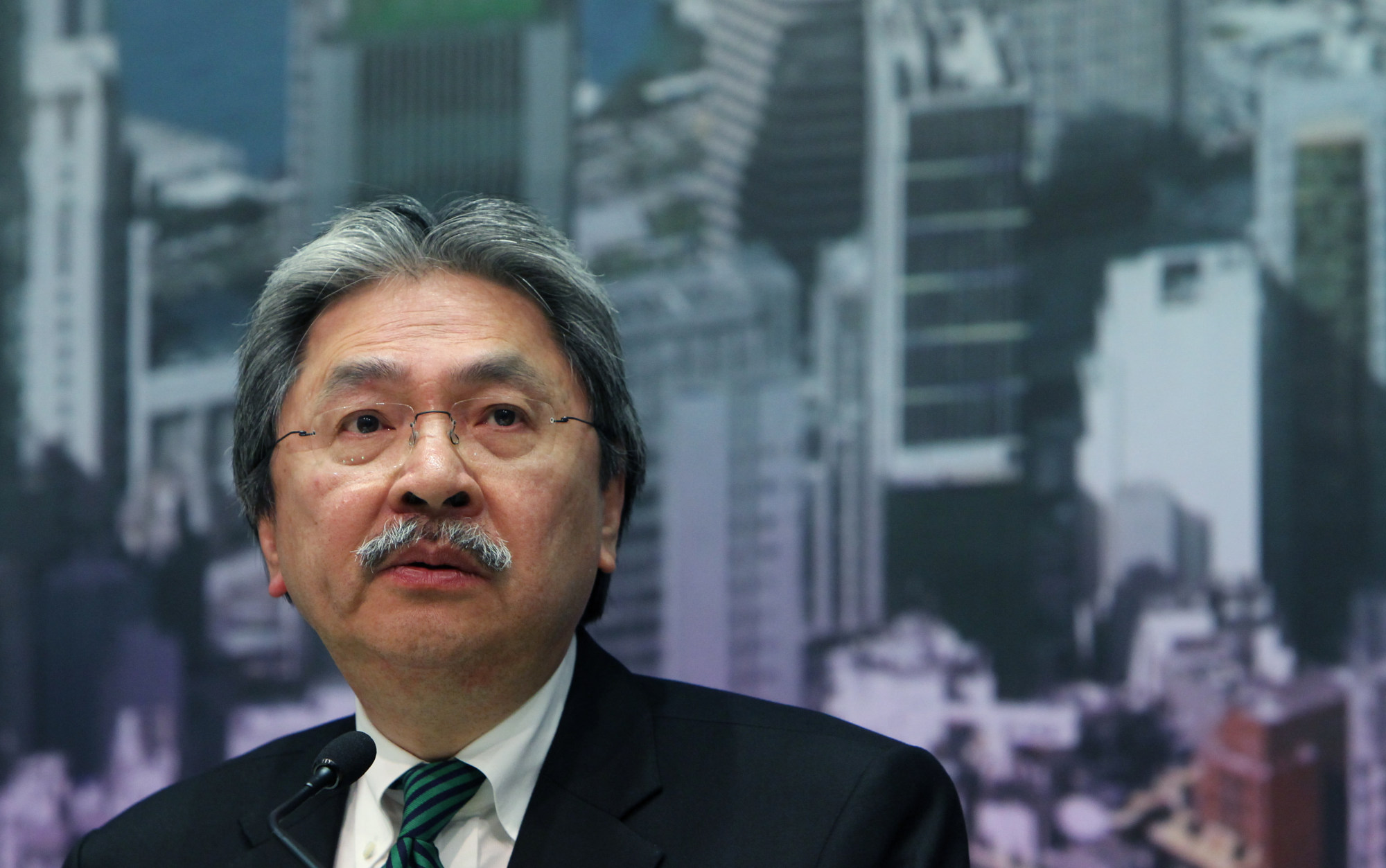 Financial Secretary John Tsang announces the new property cooling measures, which took effect at midnight. Photo: Felix Wong