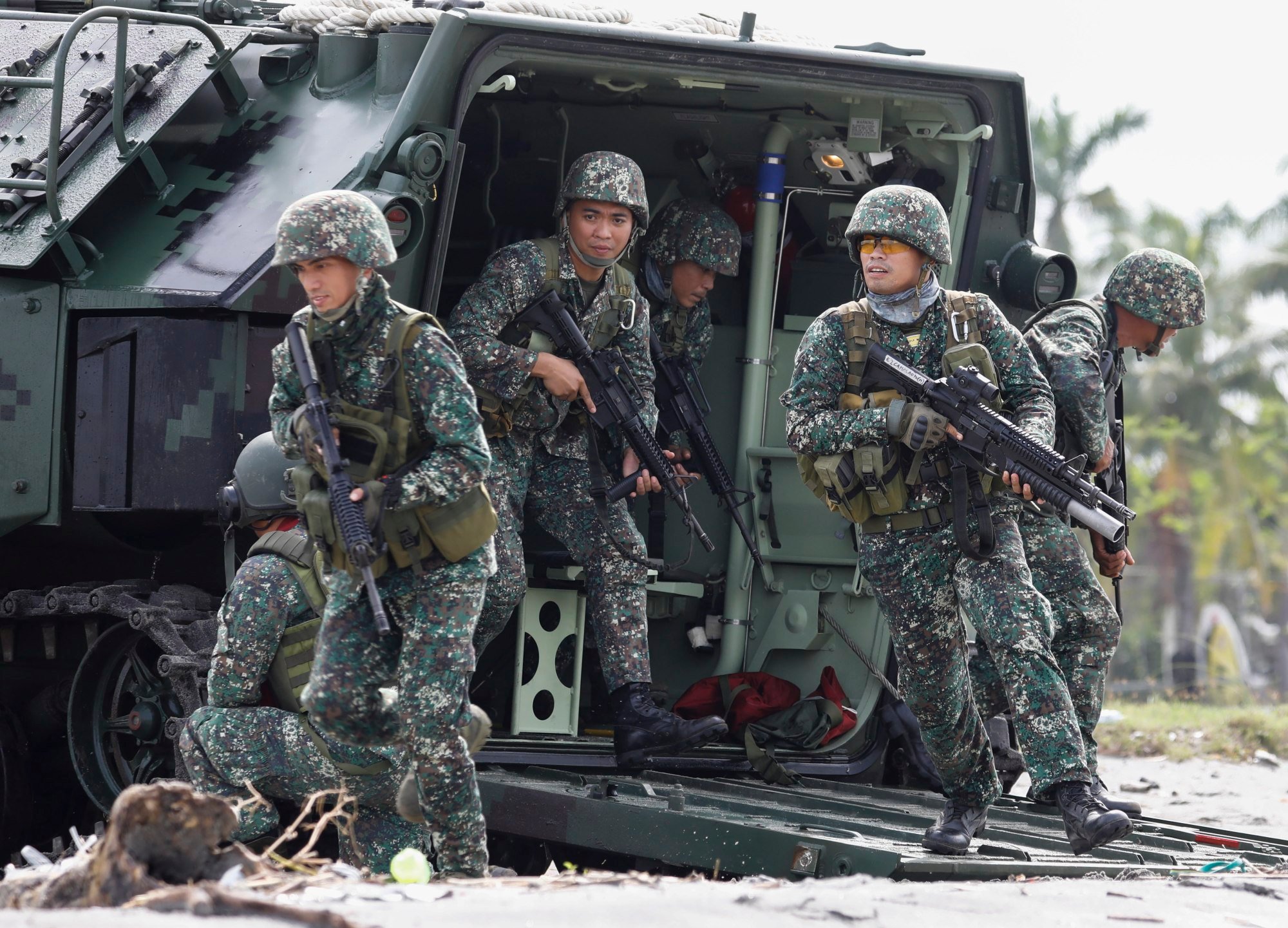 Troops composed of the Philippine Marines and Armed Forces reservists conduct an amphibious landing exercise at a beachfront in Subic Bay Freeport Zone. Photo: EPA-EFE