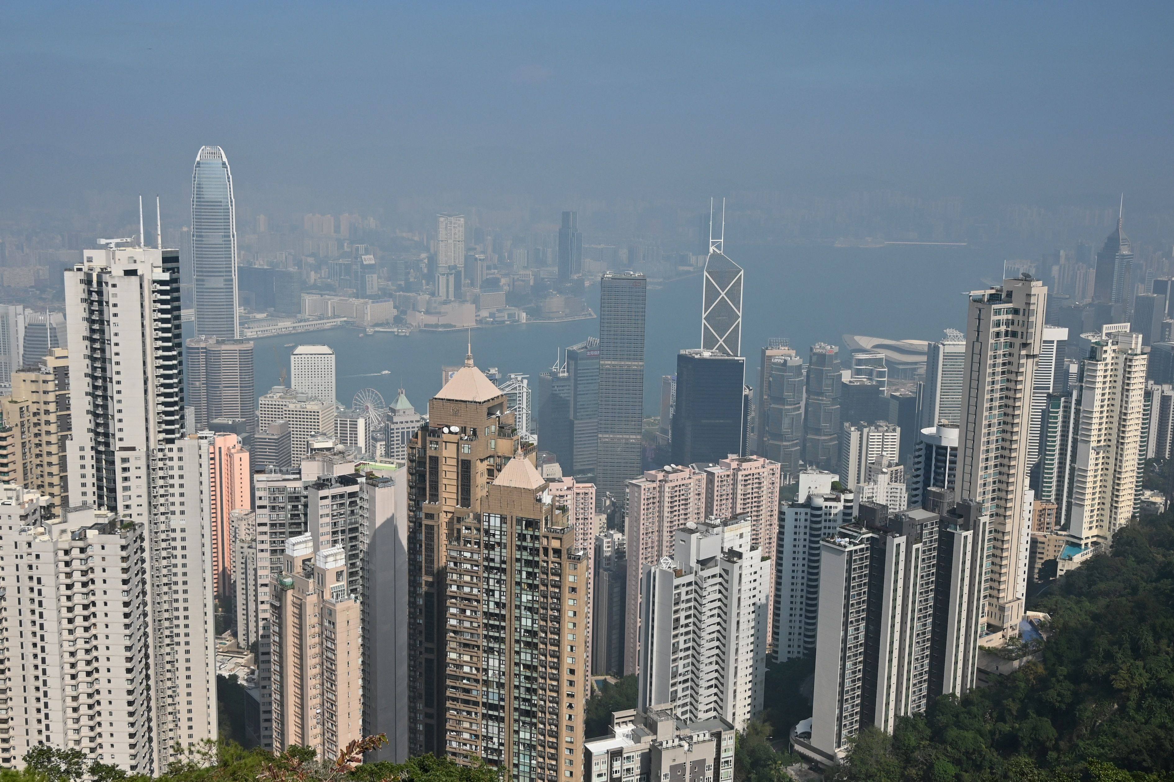 A veil of smog hangs over the Hong Kong skyline in December, 2021. Photo: AFP