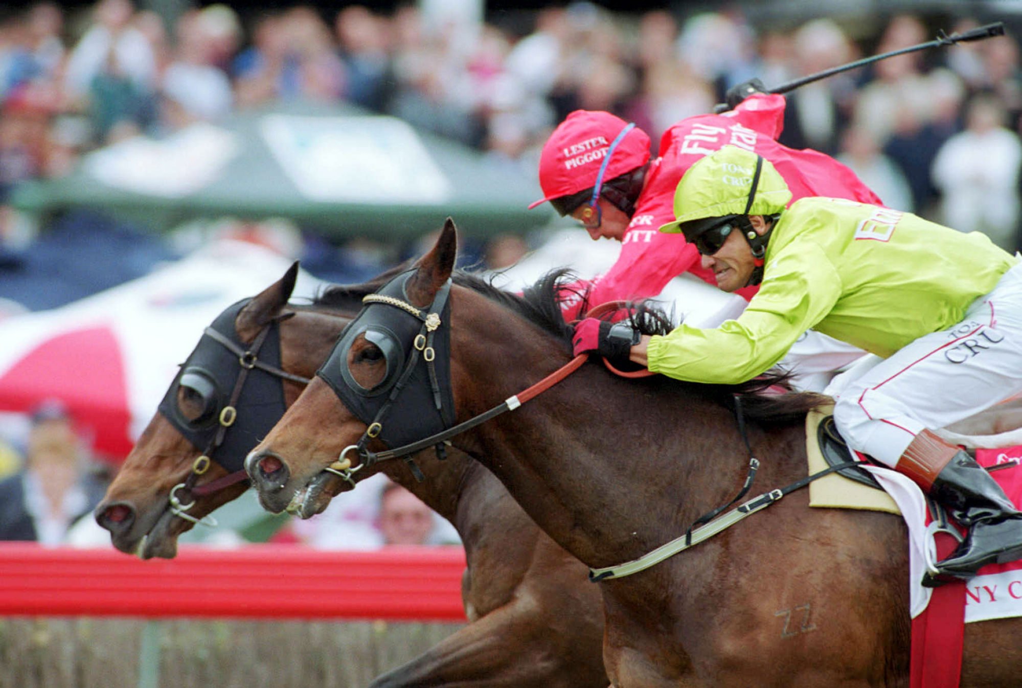 Tony Cruz (light green) and Lester Piggott fight out the finish of a legends’ race at Flemington in Melbourne in 2001. Photo: Herald Sun
