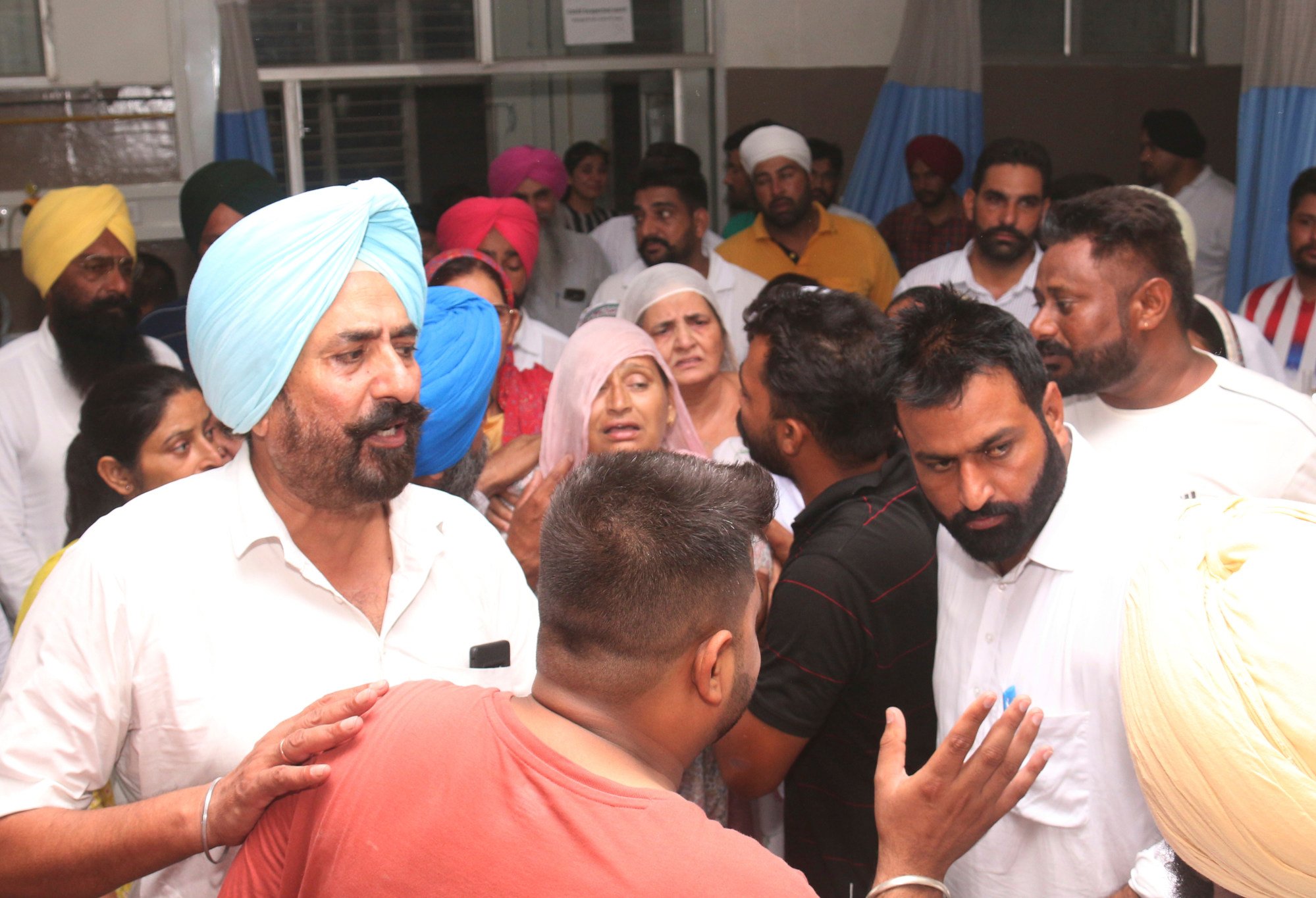Sidhu Moose Wala’s mother, centre, relatives and friends arrive at the hospital after the rapper was shot in Mansa, Punjab state, India on Sunday. Photo: AP