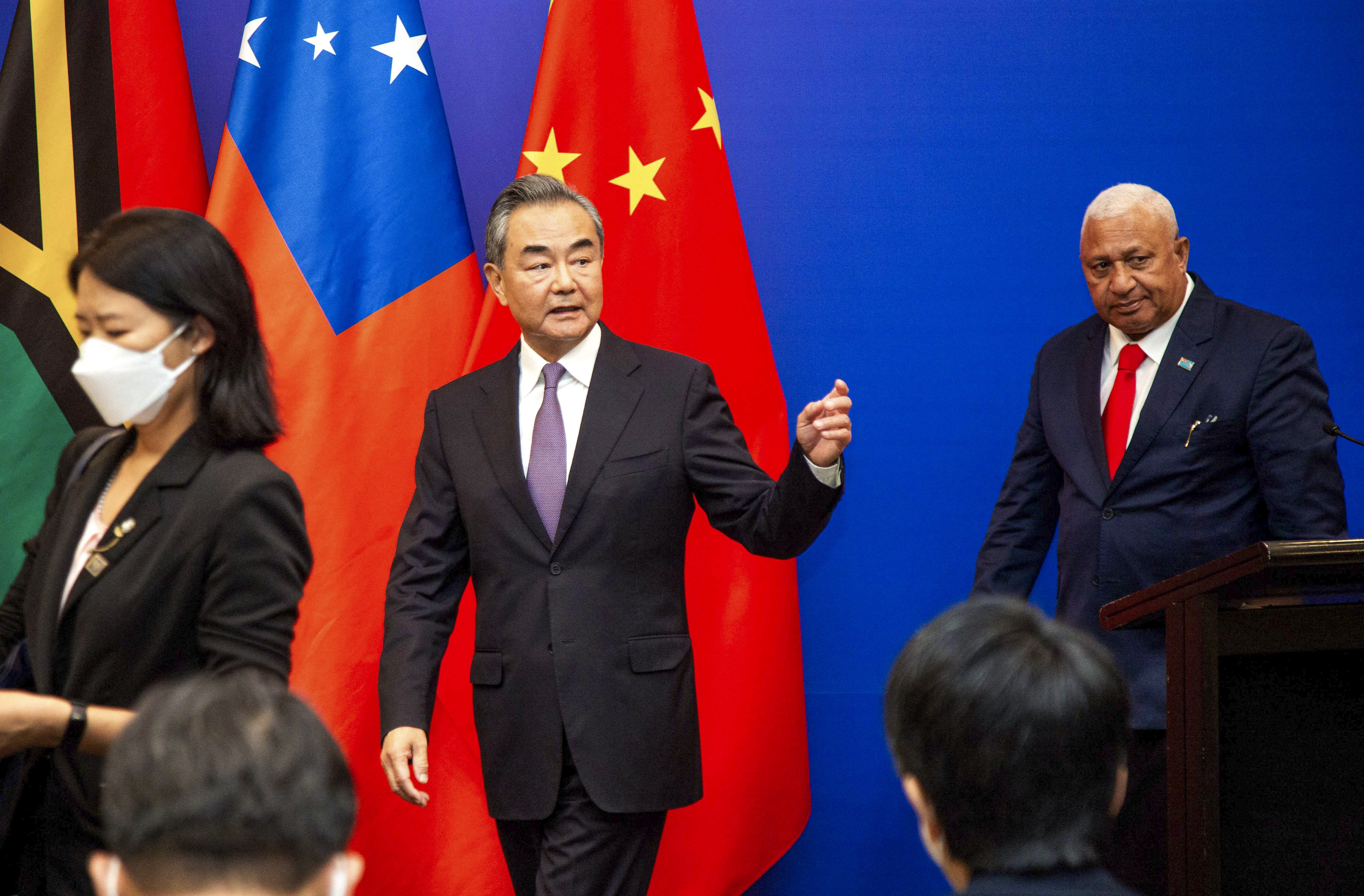 Chinese Foreign Minister Wang Yi leaves after a joint press conference with Fijian Prime Minister Frank Bainimarama in Fiji’s capital city Suva. Photo: AFP