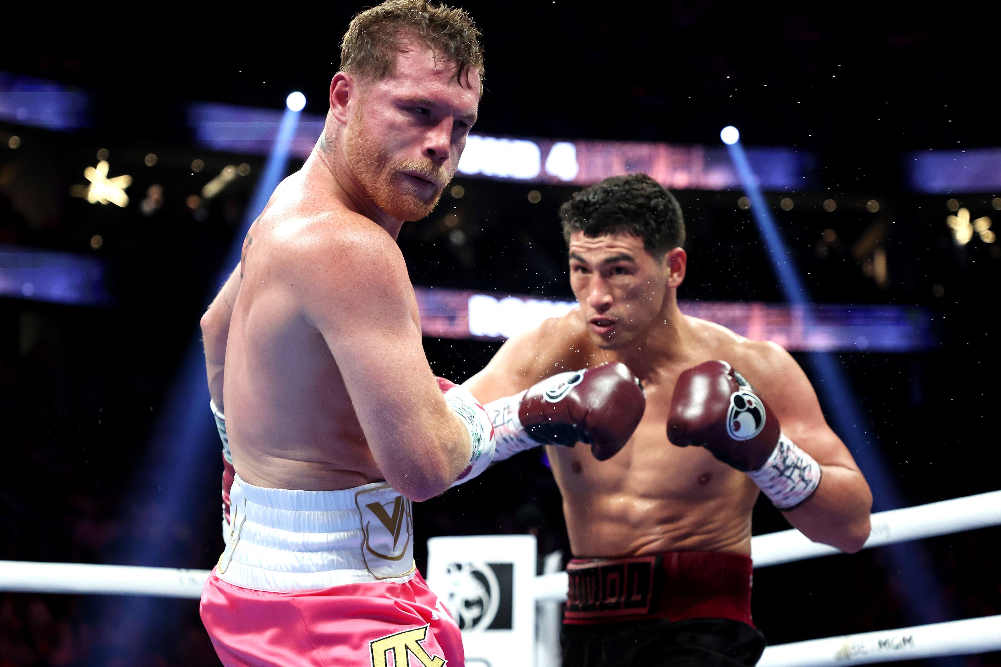 Dmitry Bivol punches Canelo Alvarez during their WBA light heavyweight title fight at T-Mobile Arena on May 7, 2022 in Las Vegas, Nevada. Photo: AFP