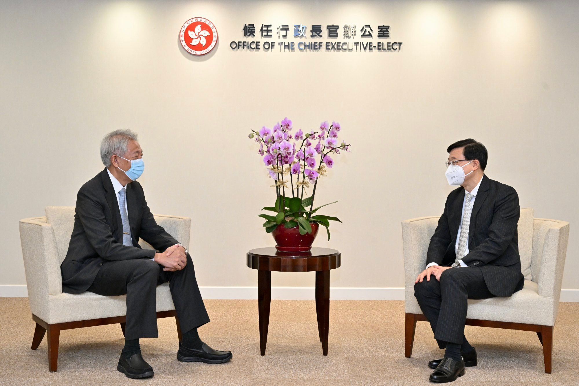 Hong Kong Chief Executive-elect <b>John</b> <b>Lee</b> (right)