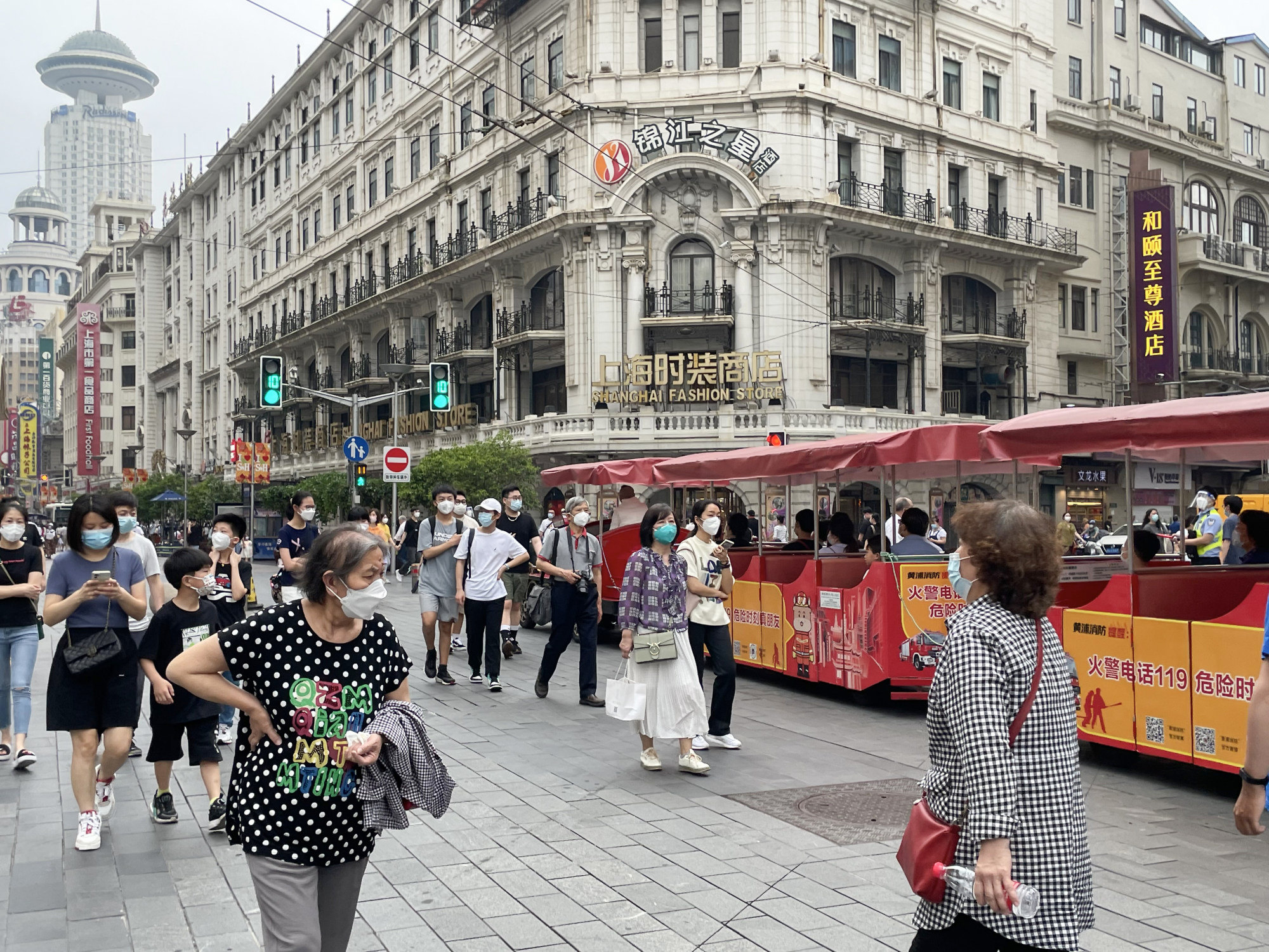 At Shanghai’s Nanjing Road, foot traffic has become busy again on June 1, 2022, after the financial and commercial hub lifted its two-month lockdown. Photo: Tracy Qu