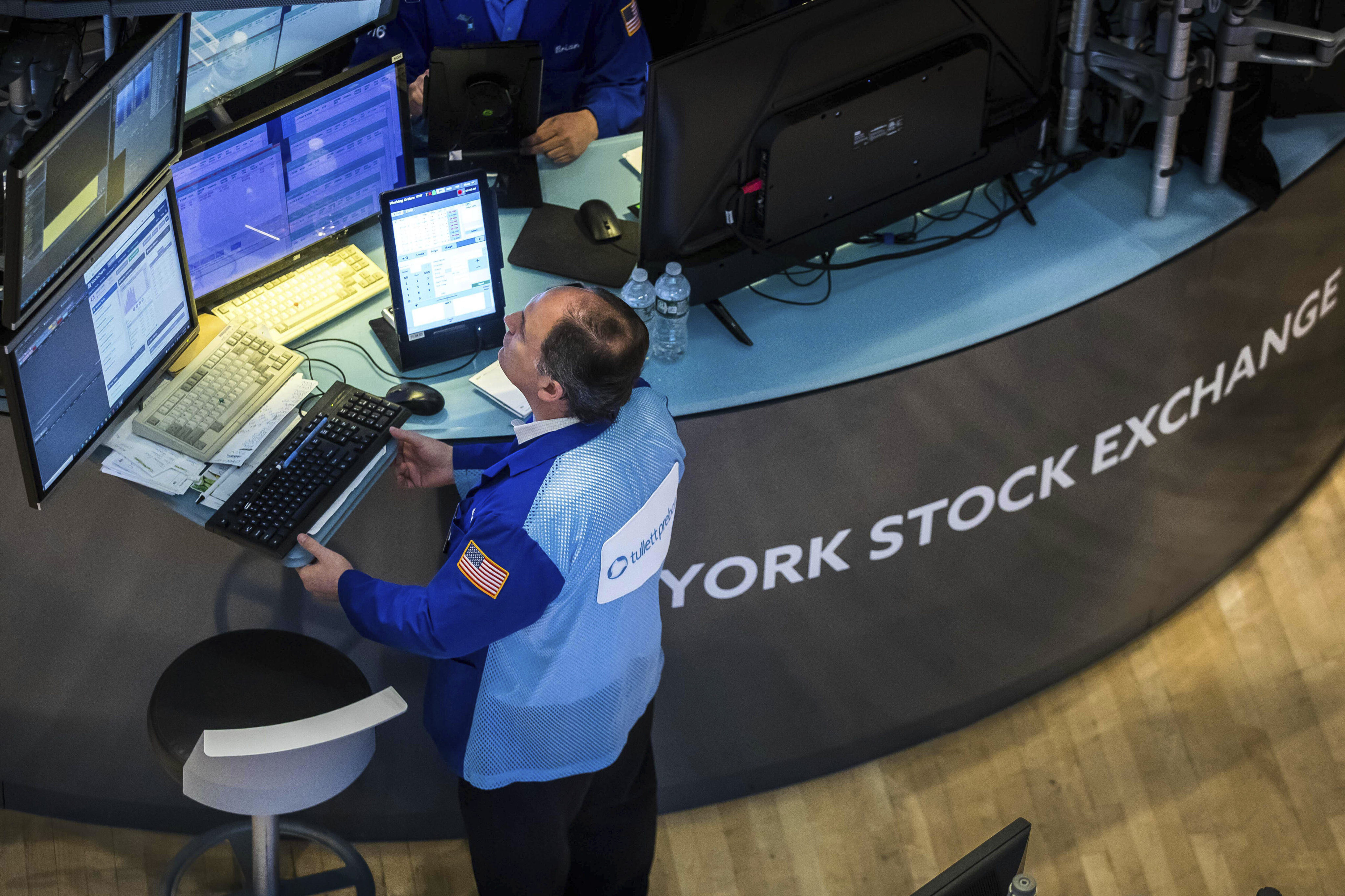 A trader is seen at work on the New York Stock Exchange on June 1. Stock markets have been doing a poor job in directing savings into long-term investment. Photo: New York Stock Exchange via AP