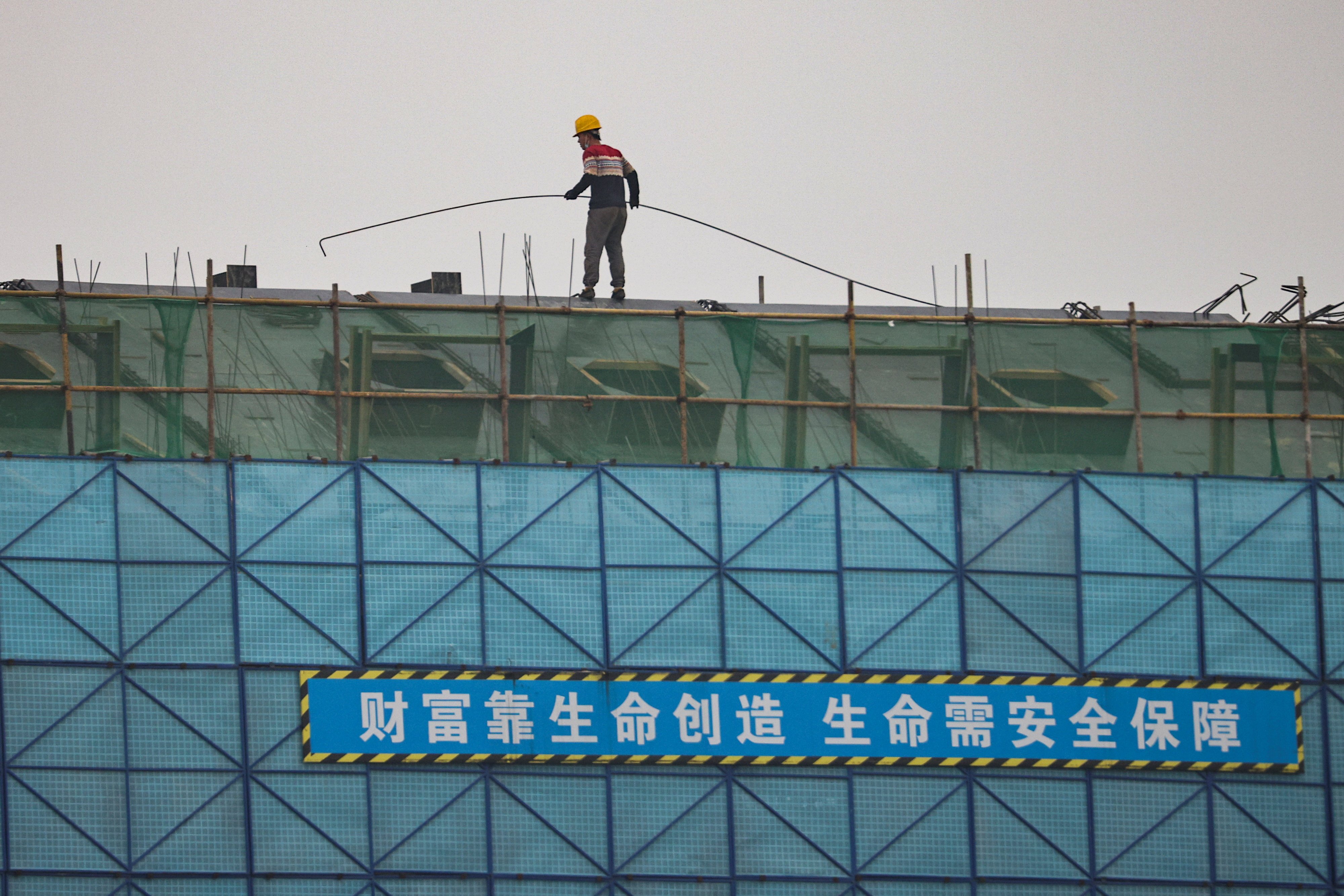 A construction site in Beijing. Developers’ contracted sales have stopped falling further from March and April, according to one of the largest real estate brokers in China. Photo: Reuters