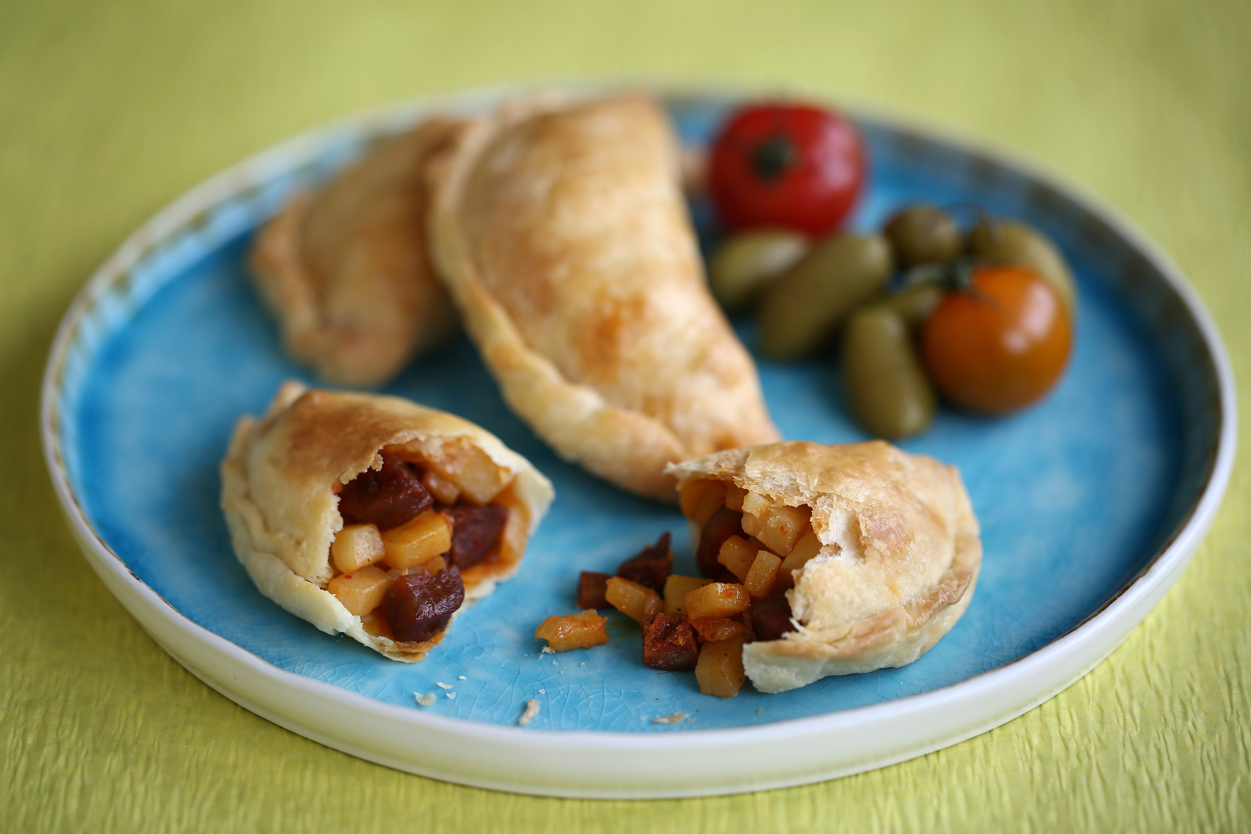 Empanadas with cream cheese pastry, filled with a mix of potatoes, Spanish chorizo and onion. Photo: Jonathan Wong