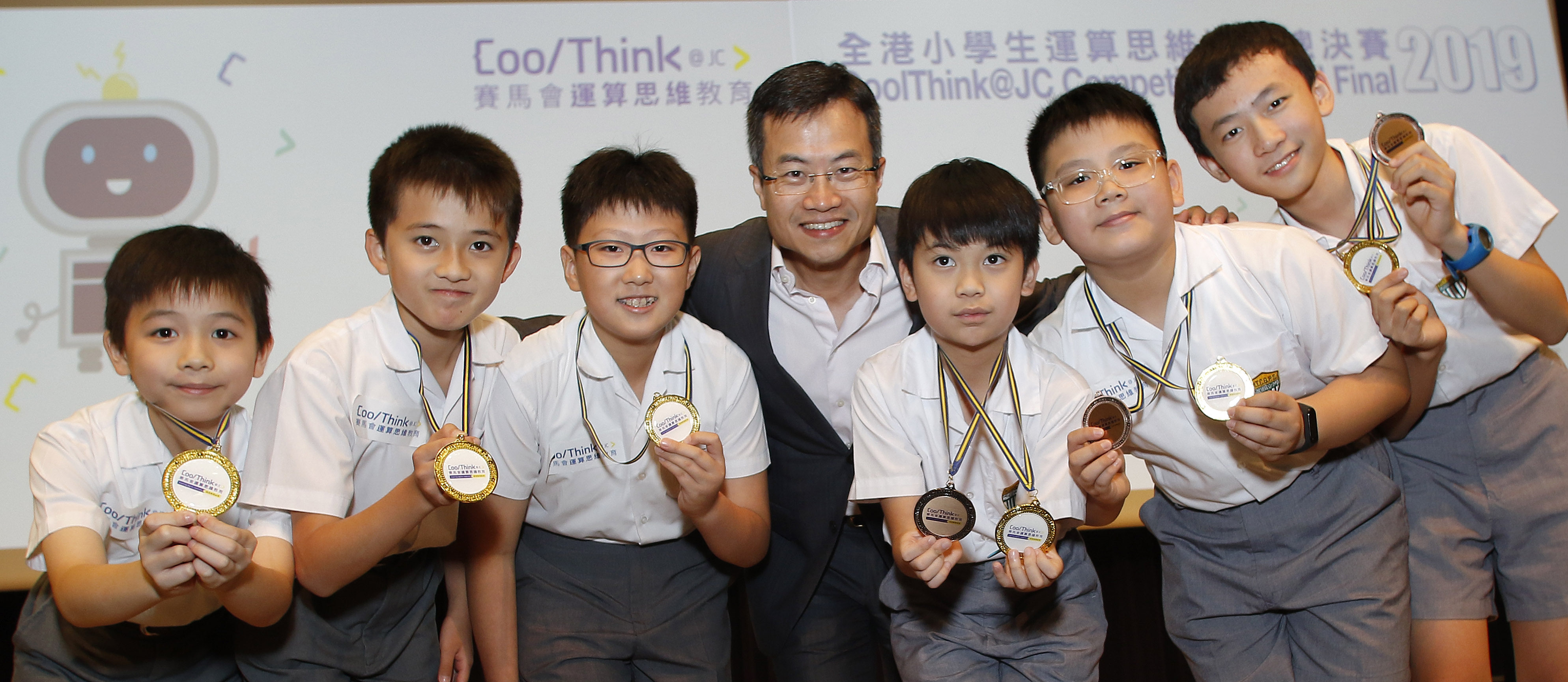 Leong Cheung, Executive Director of Charities & Community at The Hong Kong Jockey Club, presented awards to the winning team of the annual CoolThink@JC Competition. He says the programme helps prepare students for an I&T economy. This photograph was taken before the pandemic. Photo: HKJC