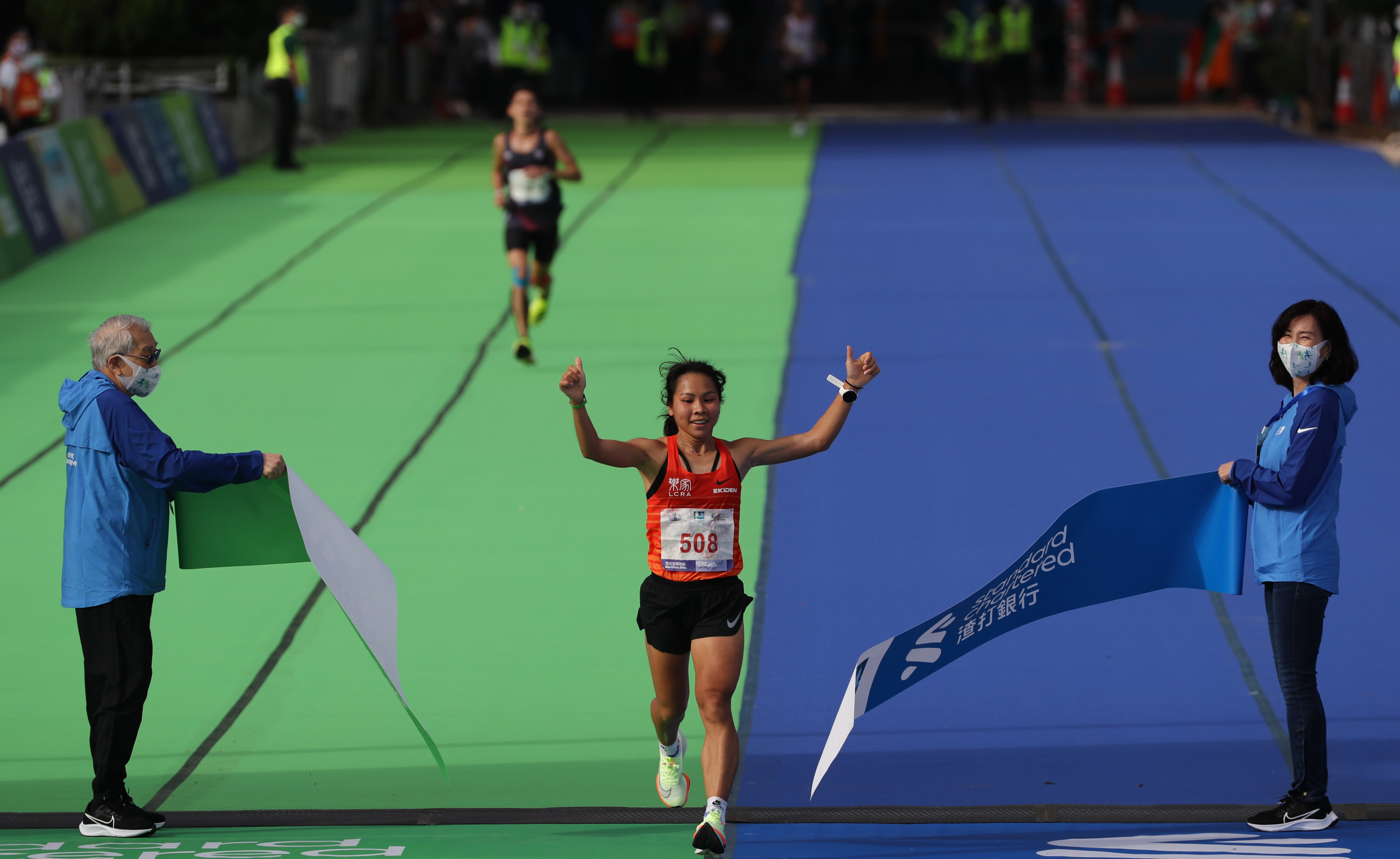 Women’s marathon champion Christy Yiu wins the 2021 Standard Chartered Hong Kong Marathon in October.  Photo: Nora Tam