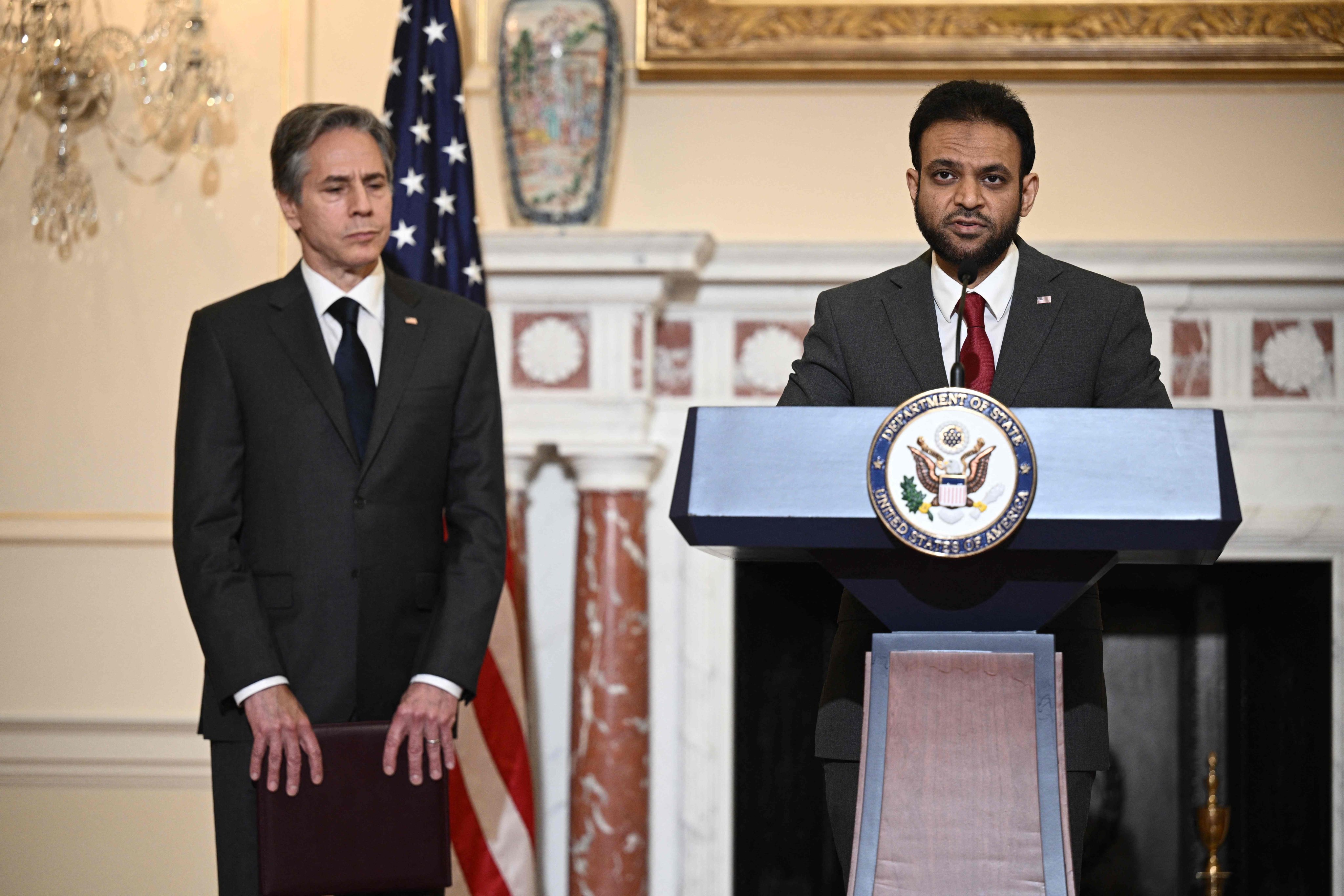 Rashad Hussain, the US ambassador at large for international religious freedom, with Secretary of State Antony Blinken, speaks on Thursday about the State Department’s new report on religious freedoms. Photo: AFP