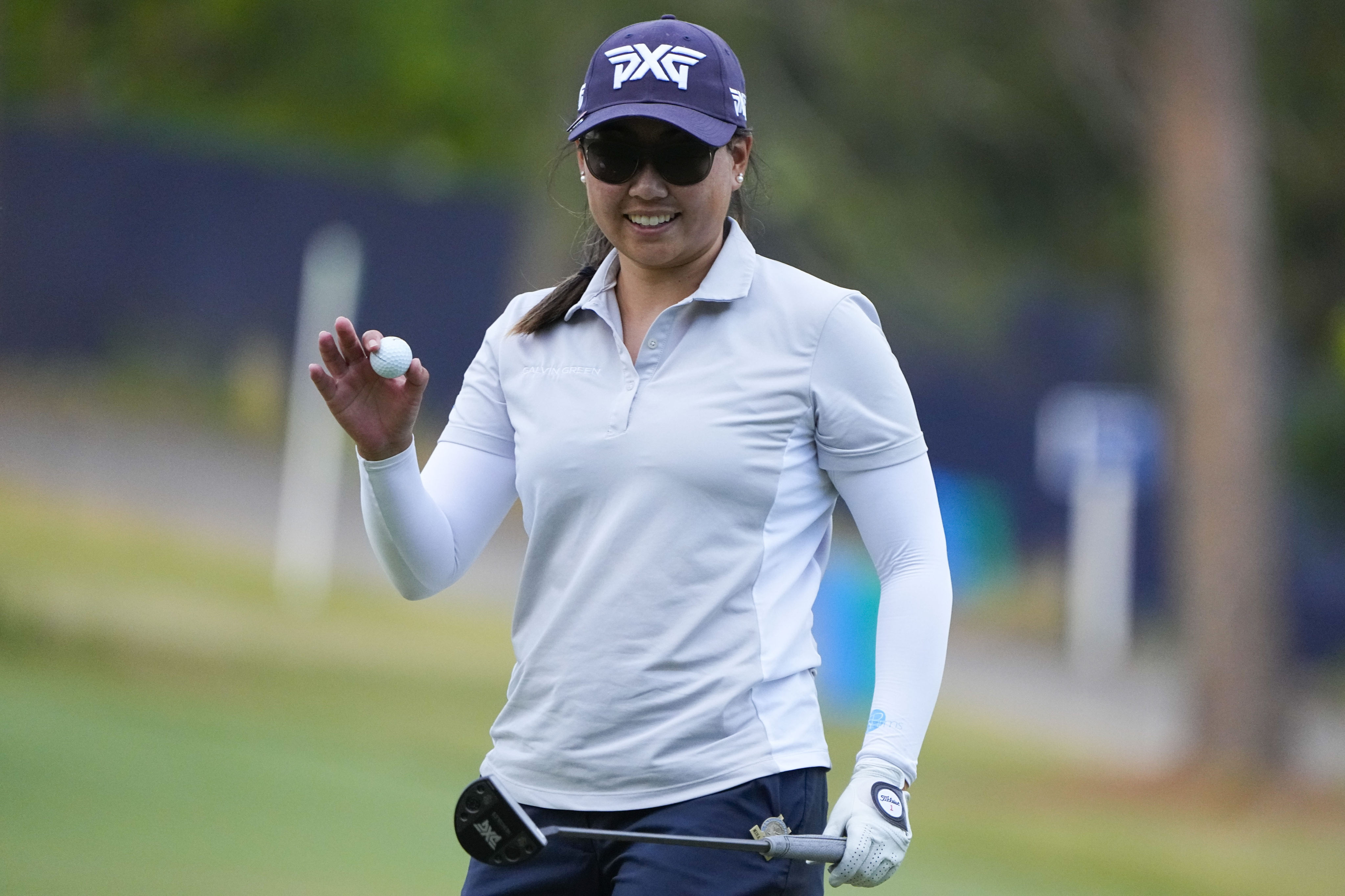 Mina Harigae smiles after saving par on the 18th during the first round of the US Women’s Open. Photo: AP