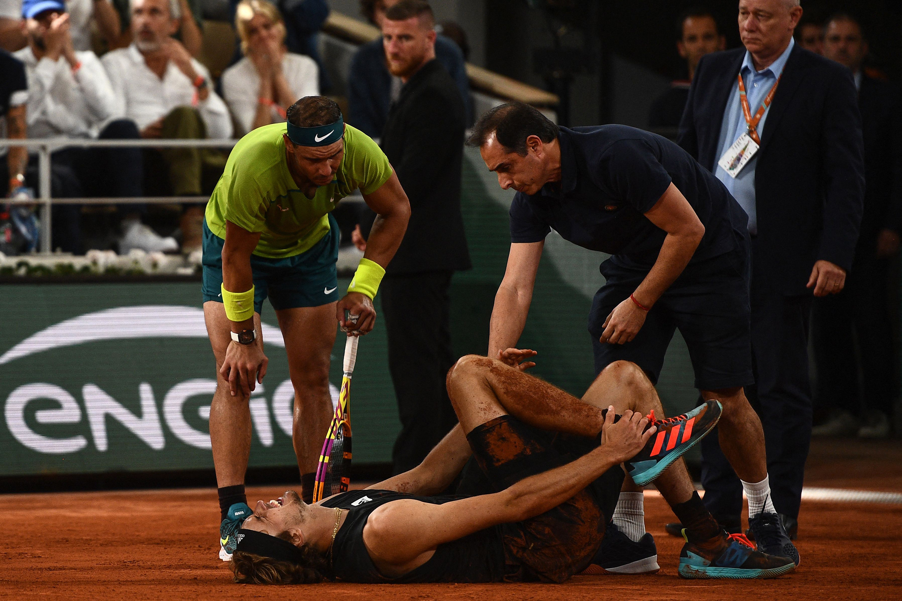 Germany’s Alexander Zverev lies on the court after being injured during his men’s semi-final singles match against Rafael Nadal. Photo: AFP