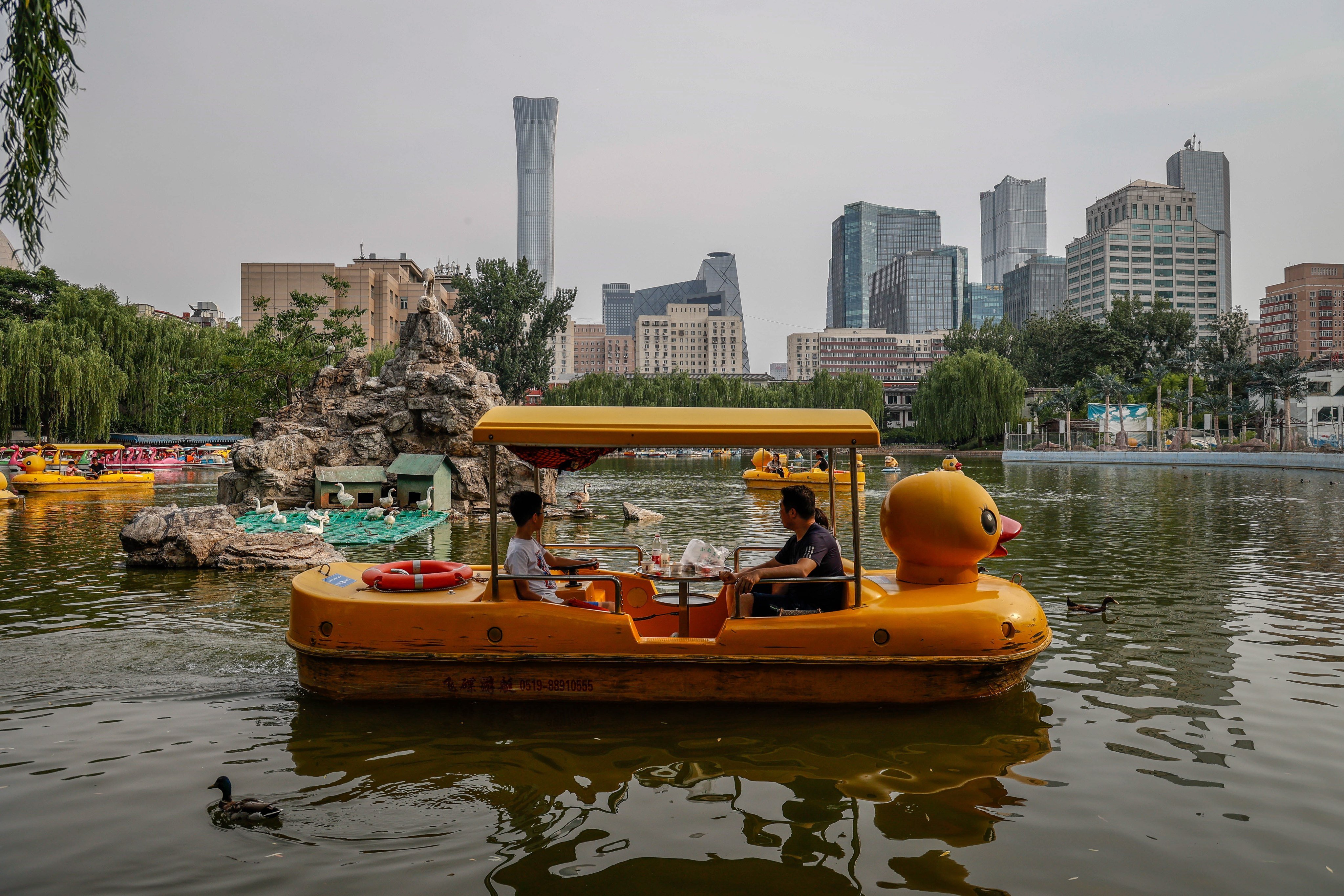 As Beijing eased Covid-19 restrictions, people flocked to parks to celebrate the Dragon Boat Festival. Photo: EPA-EFE