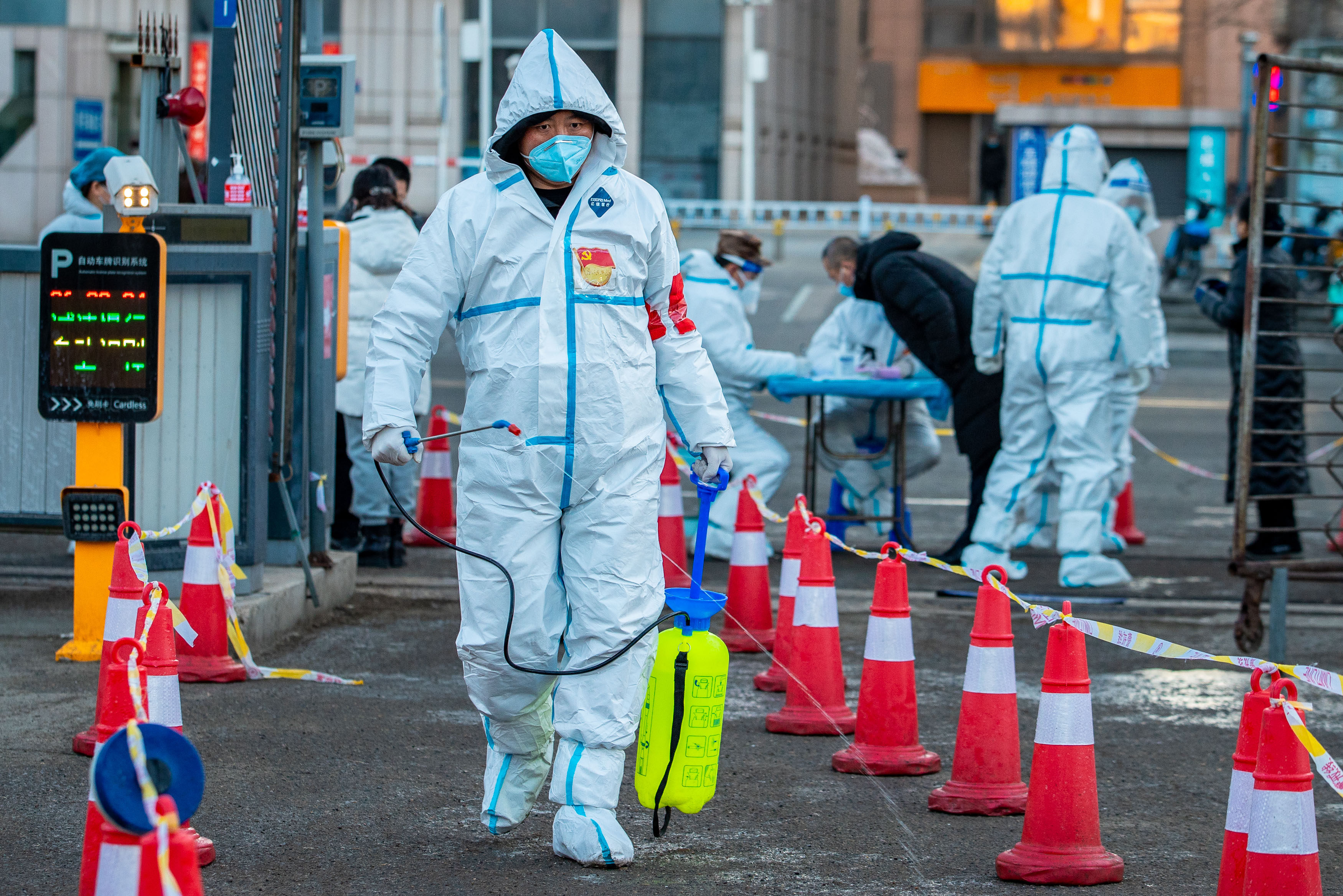 Volunteers disinfect a temporary Covid-19 testing site in Hohhot, Inner Mongolia, in late February 23. The region has been struck by a number of outbreaks this year. Photo: Costfoto/Future Publishing via Getty Images
