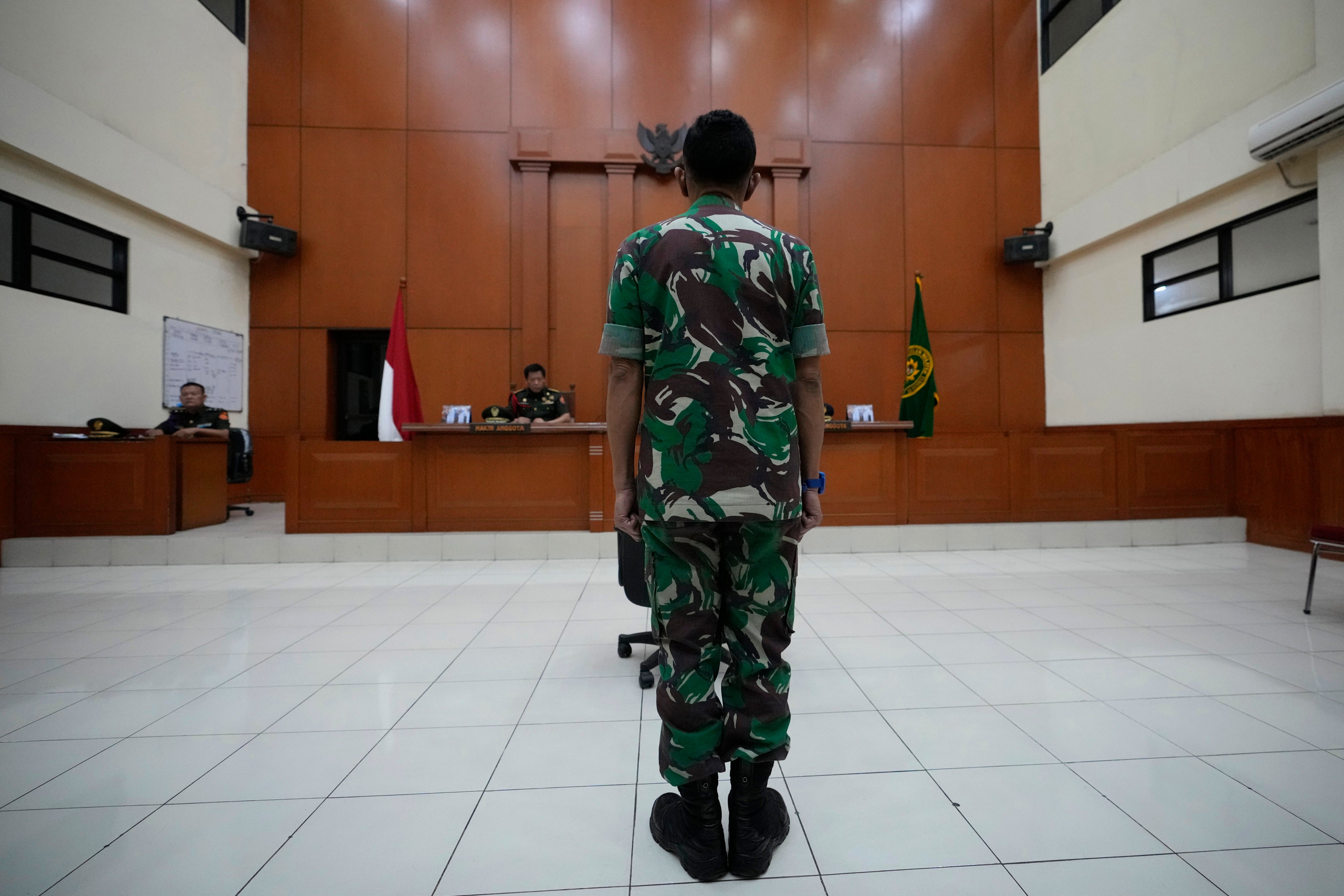 Colonel Priyanto stands in a courtroom during his trial at the military court in Jakarta, Indonesia. Photo: AP
