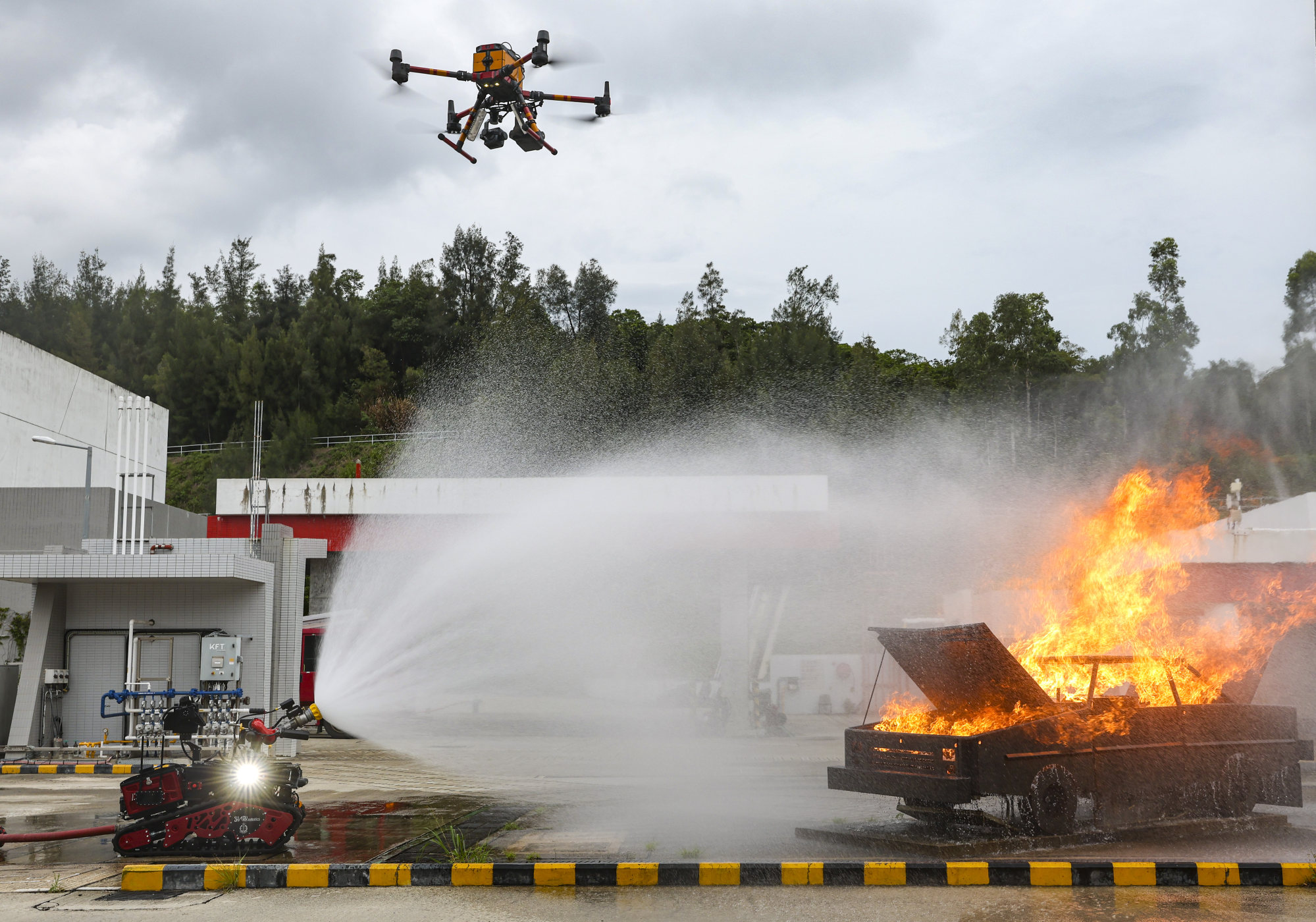 The multi-rotor small unmanned aircraft and firefighting robot during a training exercise at the Fire and Ambulance Services Academy in Tseung Kwan O. Photo: Edmond So
