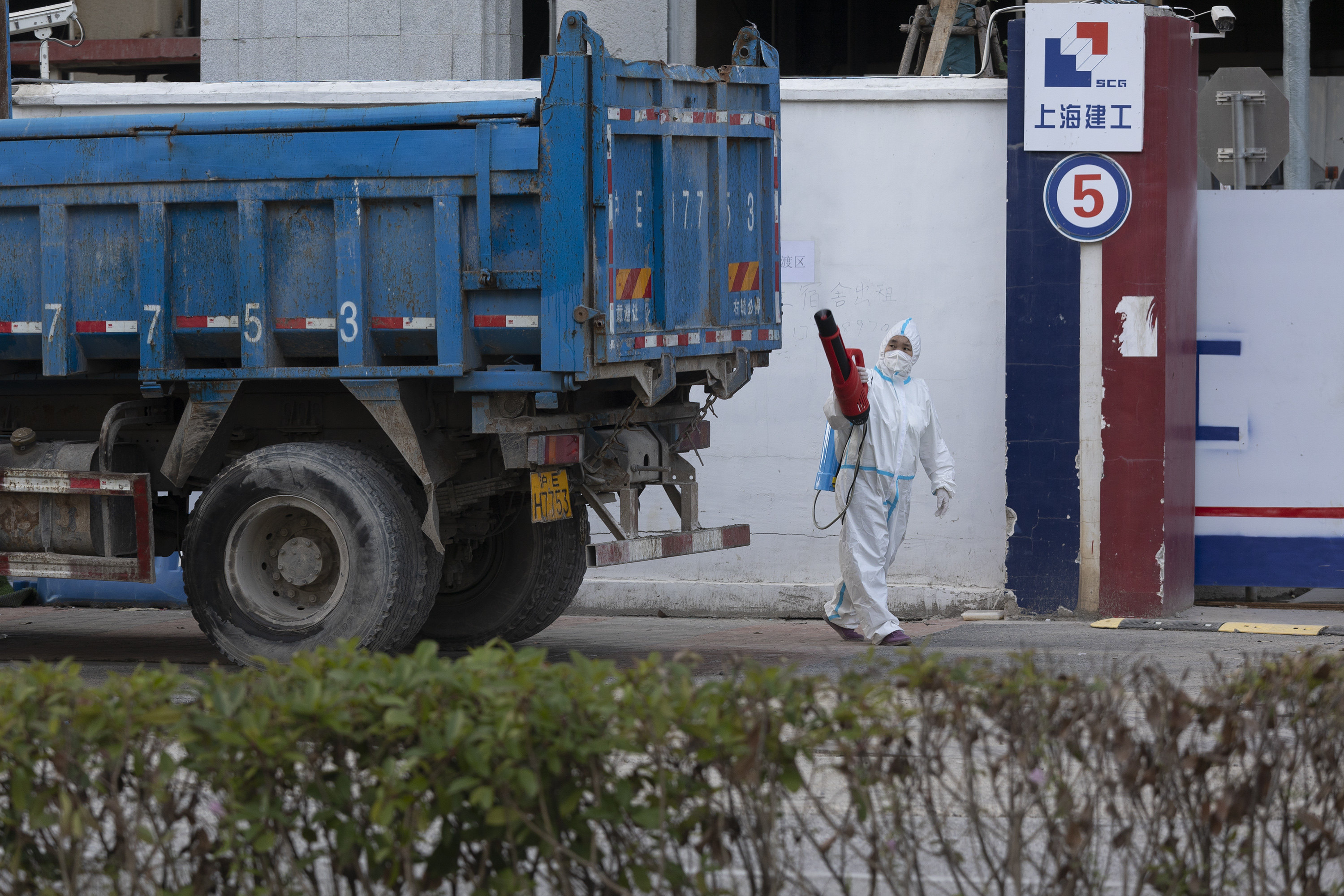 A truck is disinfected at a construction site in Shanghai on Tuesday. Road freight has been seriously impeded by China’s zero-Covid restrictions. Photo: Getty Images