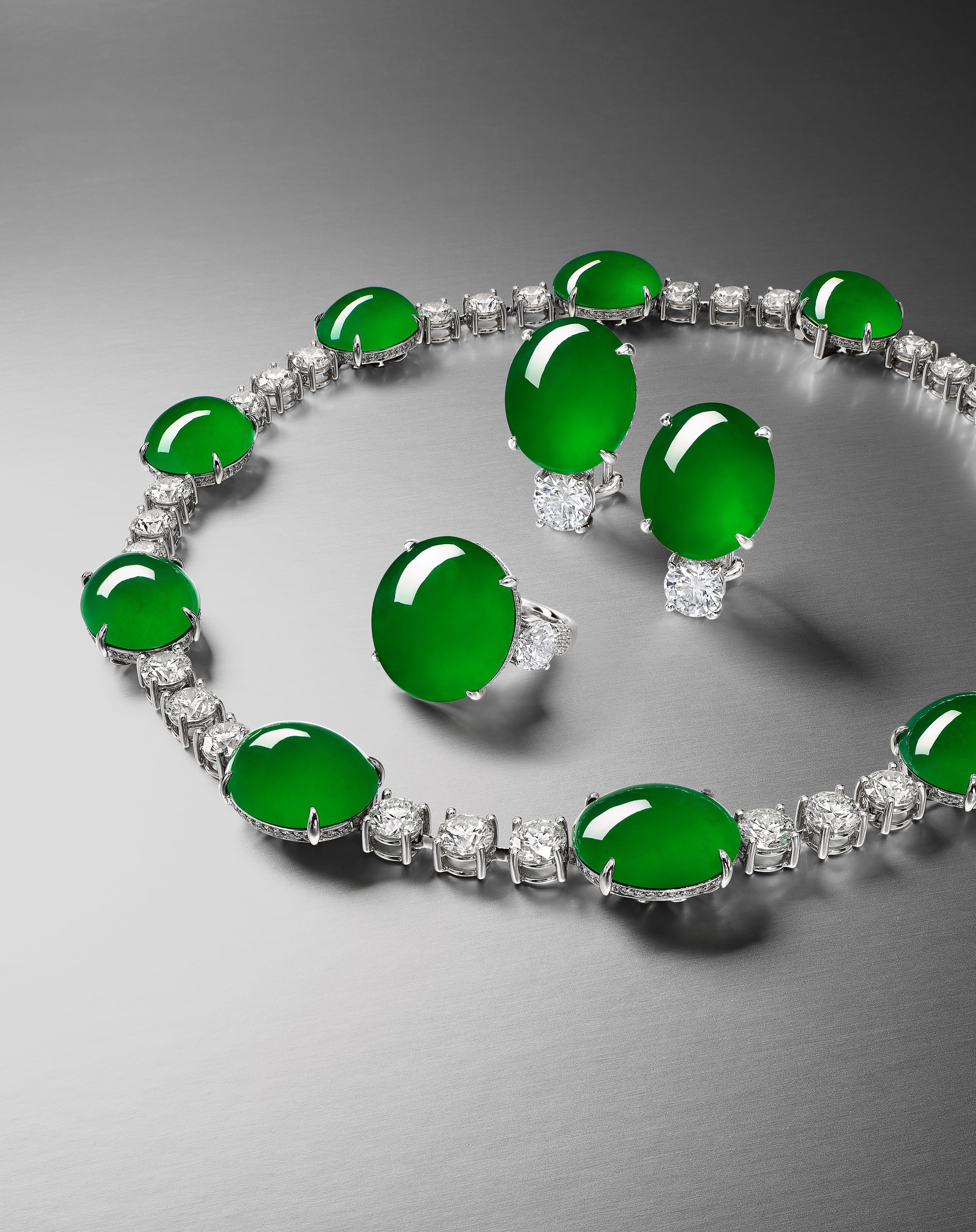 Imperial green jadeite and diamond jewellery set. Photo: Sotheby’s