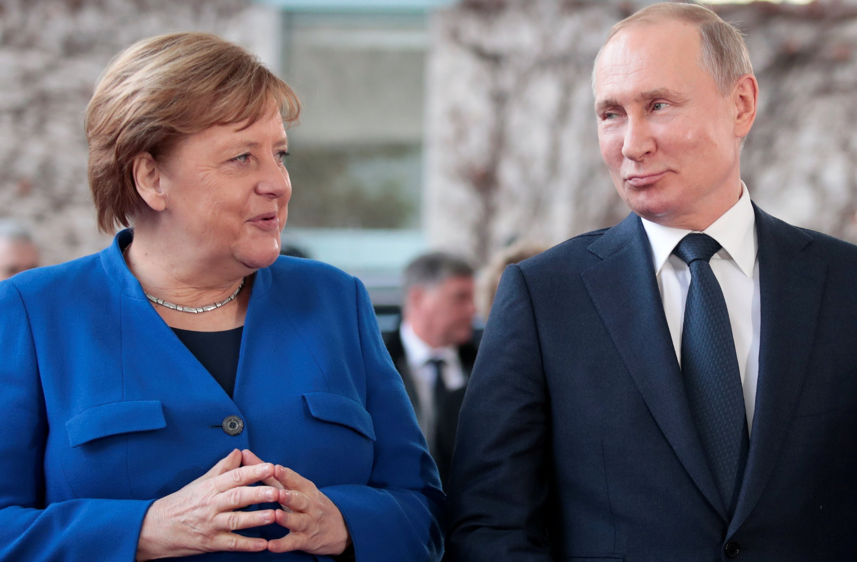 German Chancellor Angela Merkel and Russian President Vladimir Putin pose for a picture as he arrives to attend the Libya summit in Berlin in January 2020. Photo: Reuters