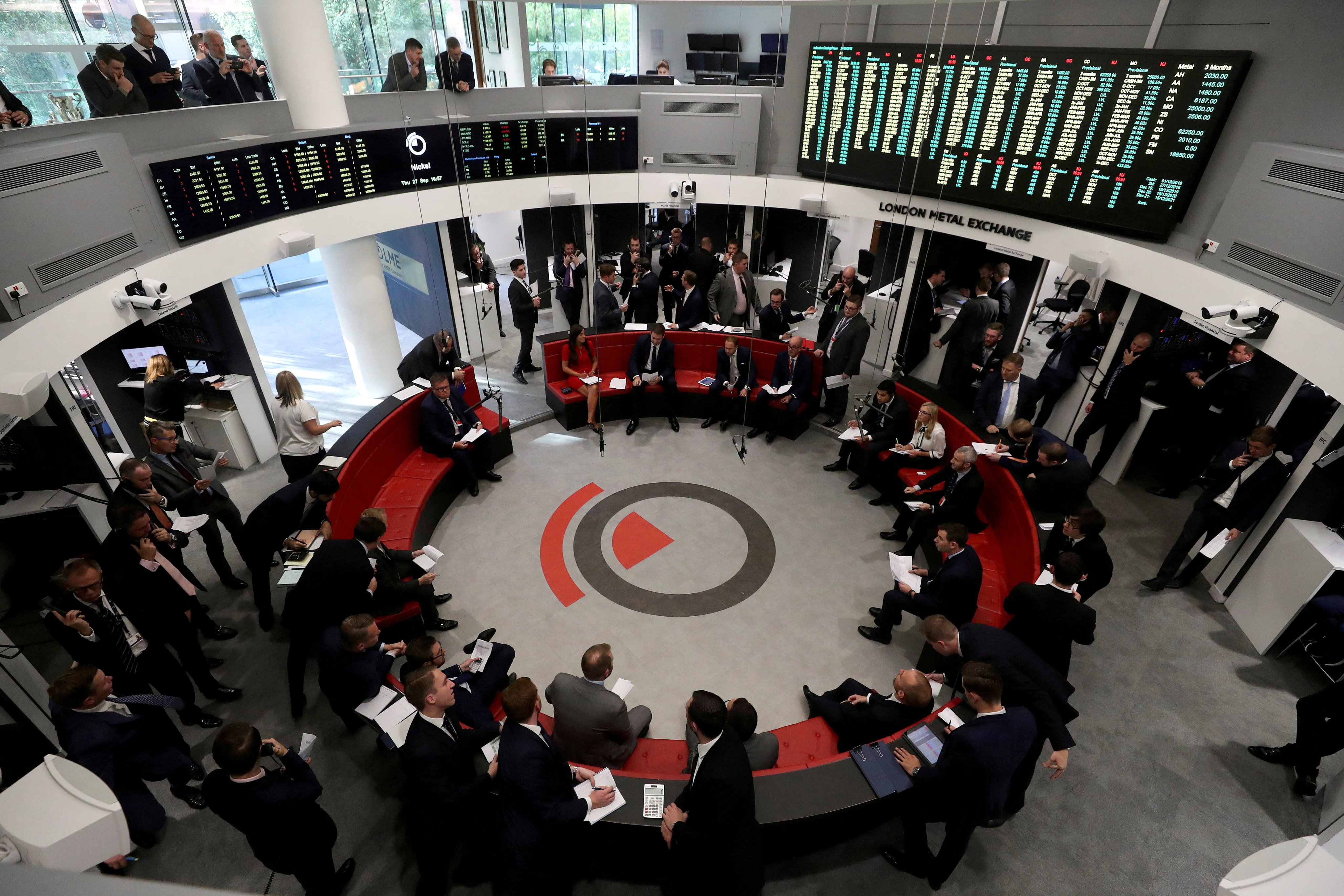 Traders work on the floor of the London Metal Exchange. Photo: Reuters 