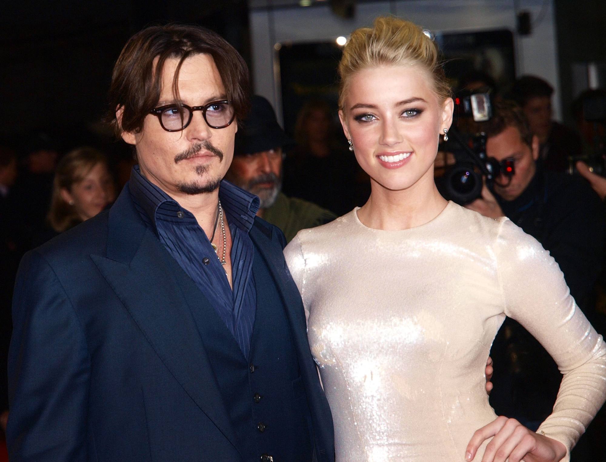 Johnny Depp and Amber Heard seen in 2011 at the European premiere of their film The Rum Diary. Photo: AFP