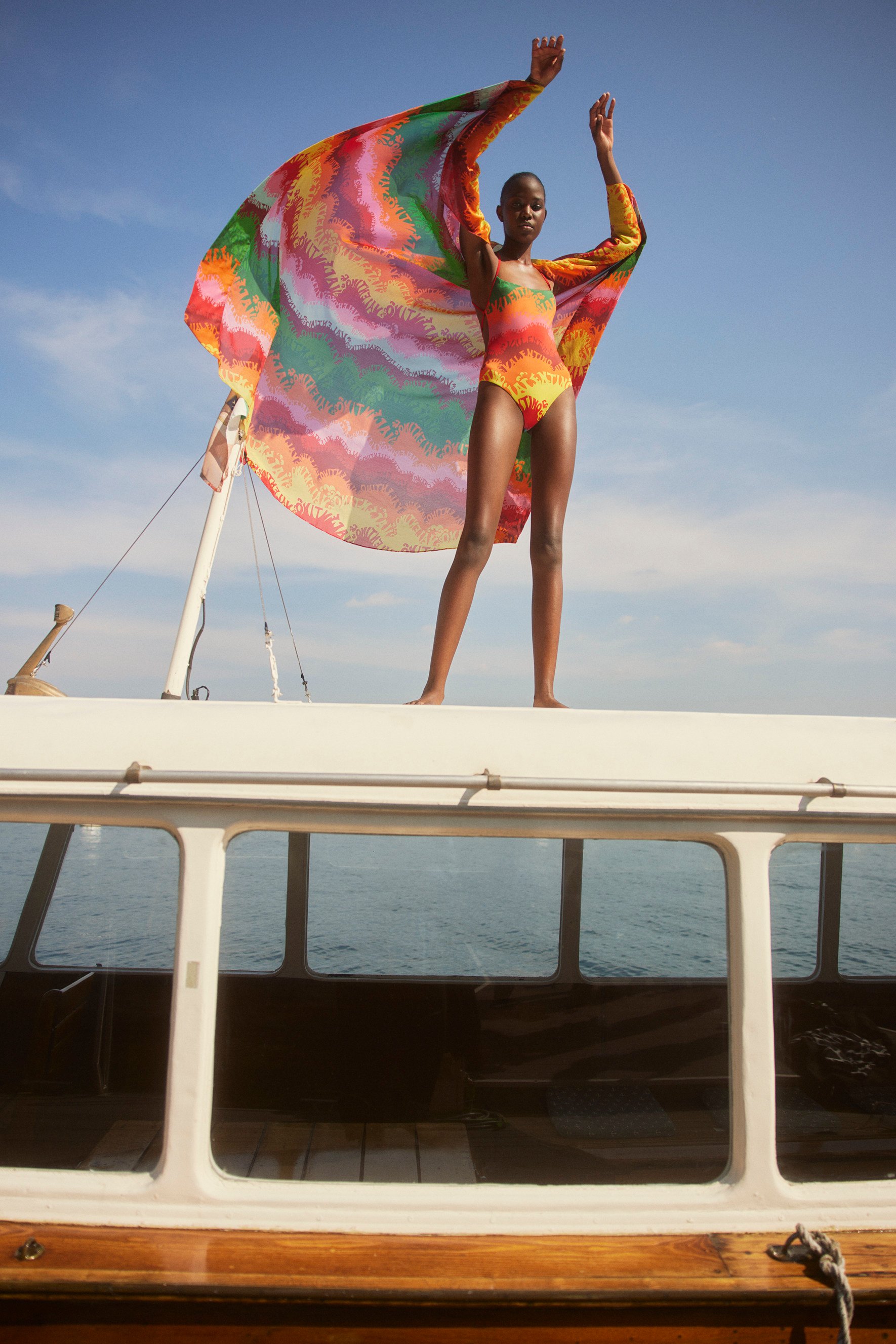 A bright one-piece swimsuit from Valentino at Mytheresa.