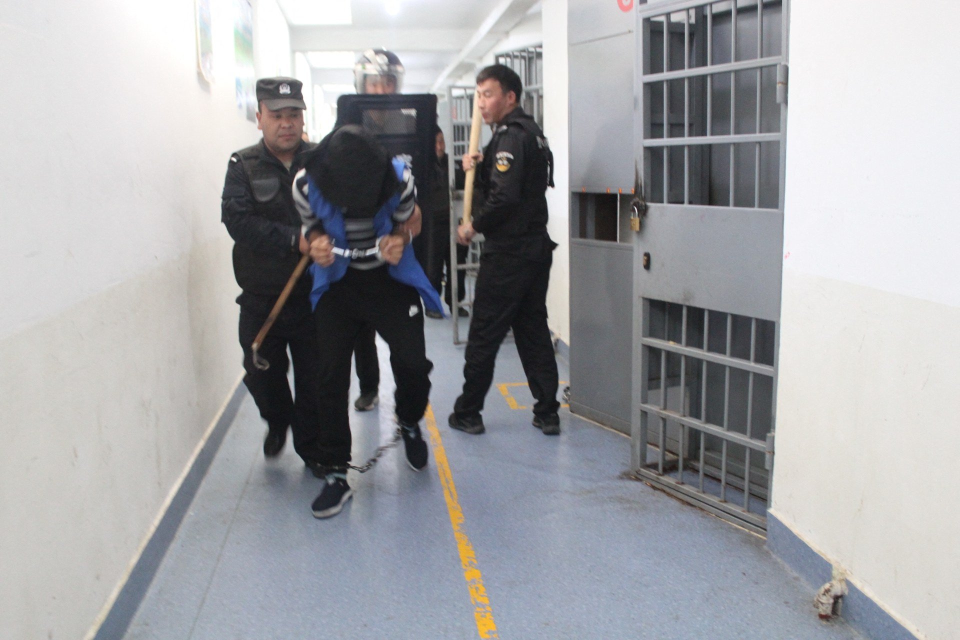 Security personnel engaged in an apparent anti-escape or anti-riot drill at the Tekes County Detention Centre in Xinjiang in February, 2018. Photo: AFP