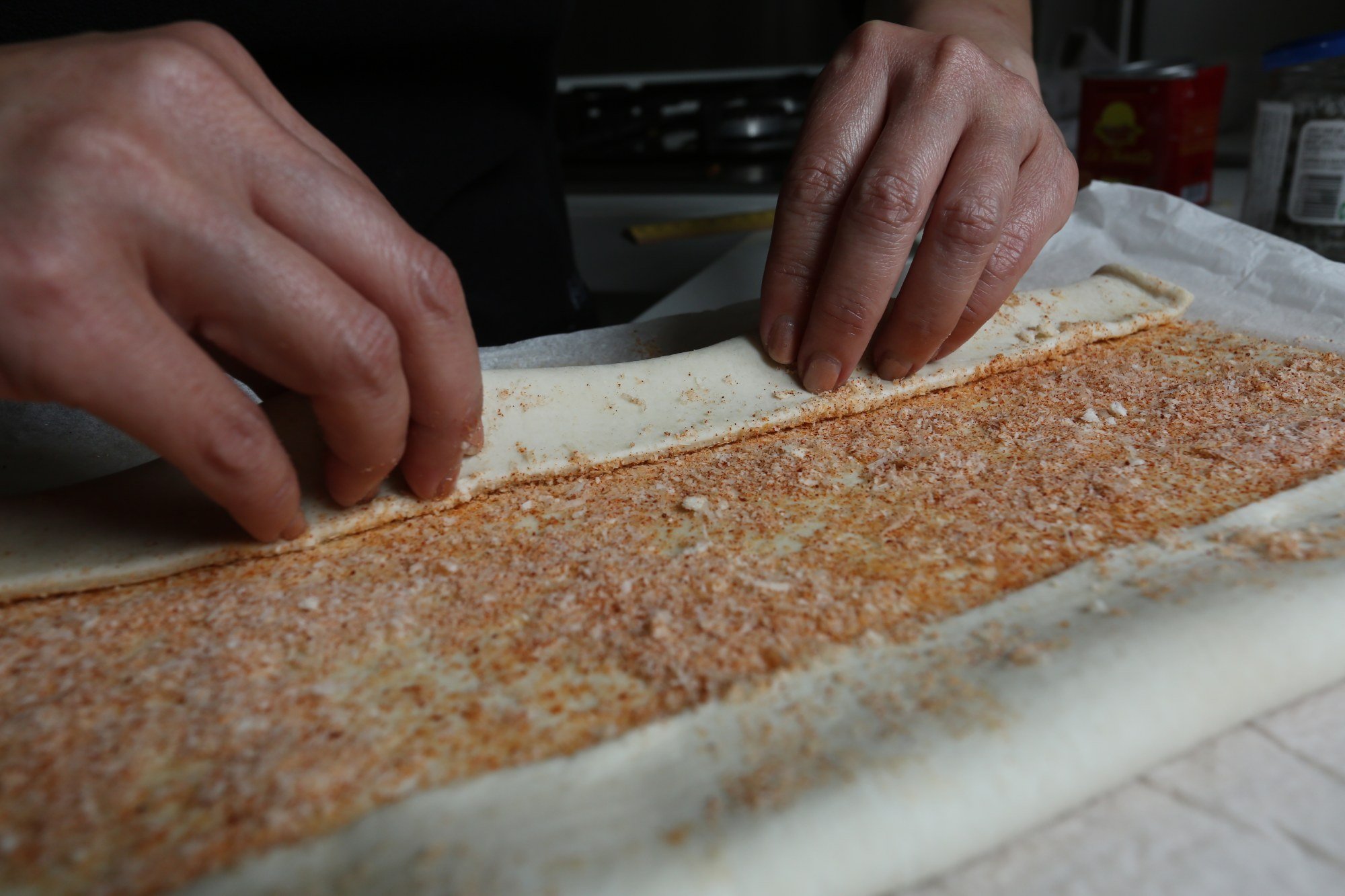 Make the Parmesan palmiers to accompany the veal tartare. Fold the bottom half of the pastry so it comes halfway to the centre. Photo: Jonathan Wong