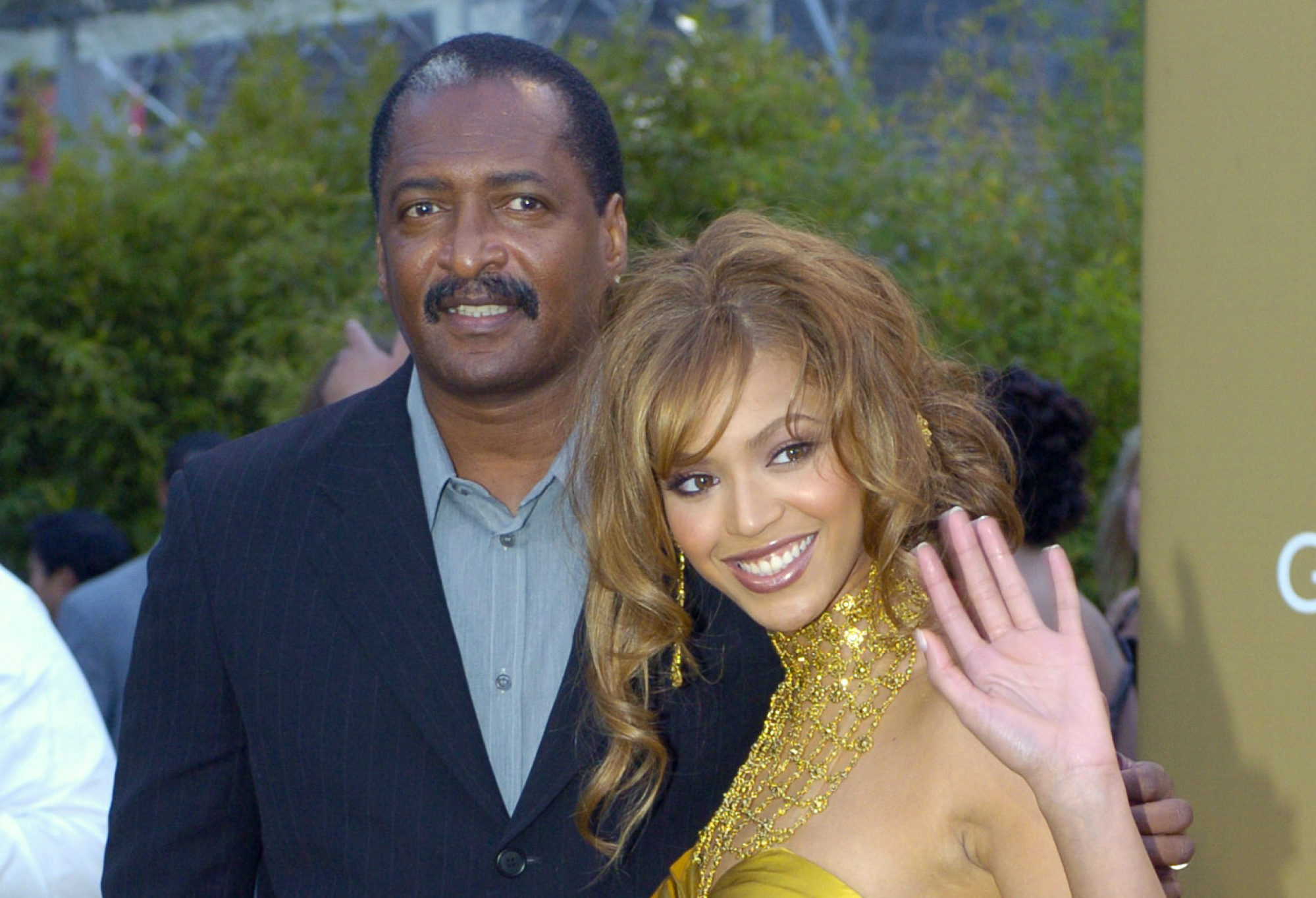 Beyoncé arrives at the Grammy Awards in 2004 with her father and manager Mathew Knowles. Photo: AP