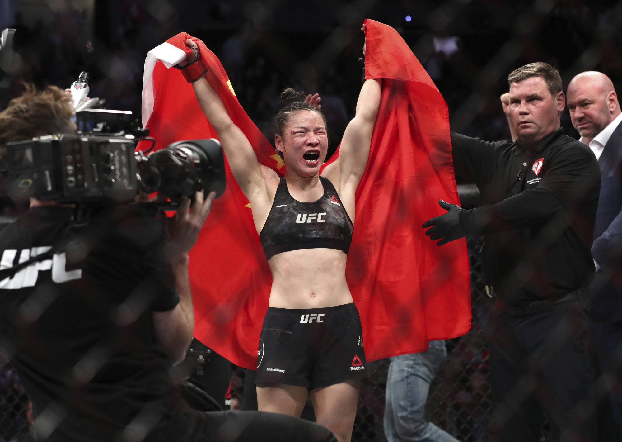 Zhang Weili of China celebrates her split decision victory over Joanna Jedrzejczyk at UFC 248. Photo: AP