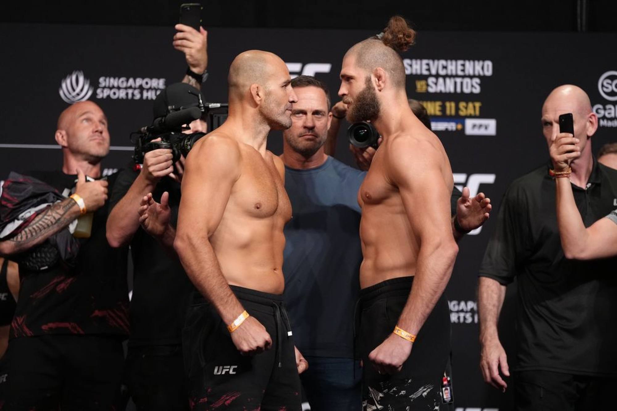 Glover Teixeira and Jiri Prochazka face off at the UFC 275 weigh-ins in Singapore.