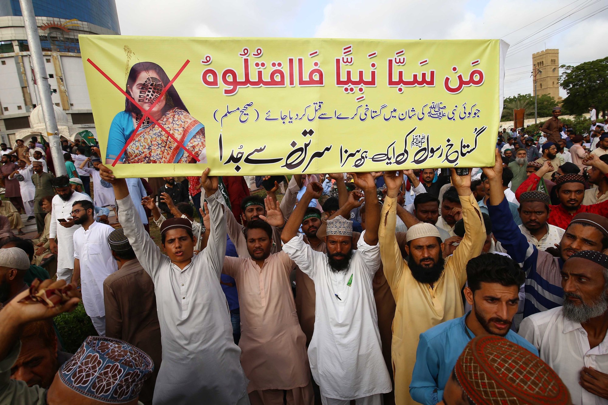 Pakistani protesters in Karachi hold up a banner slamming BJP’s Nupur Sharma. Photo: EPA-EFE