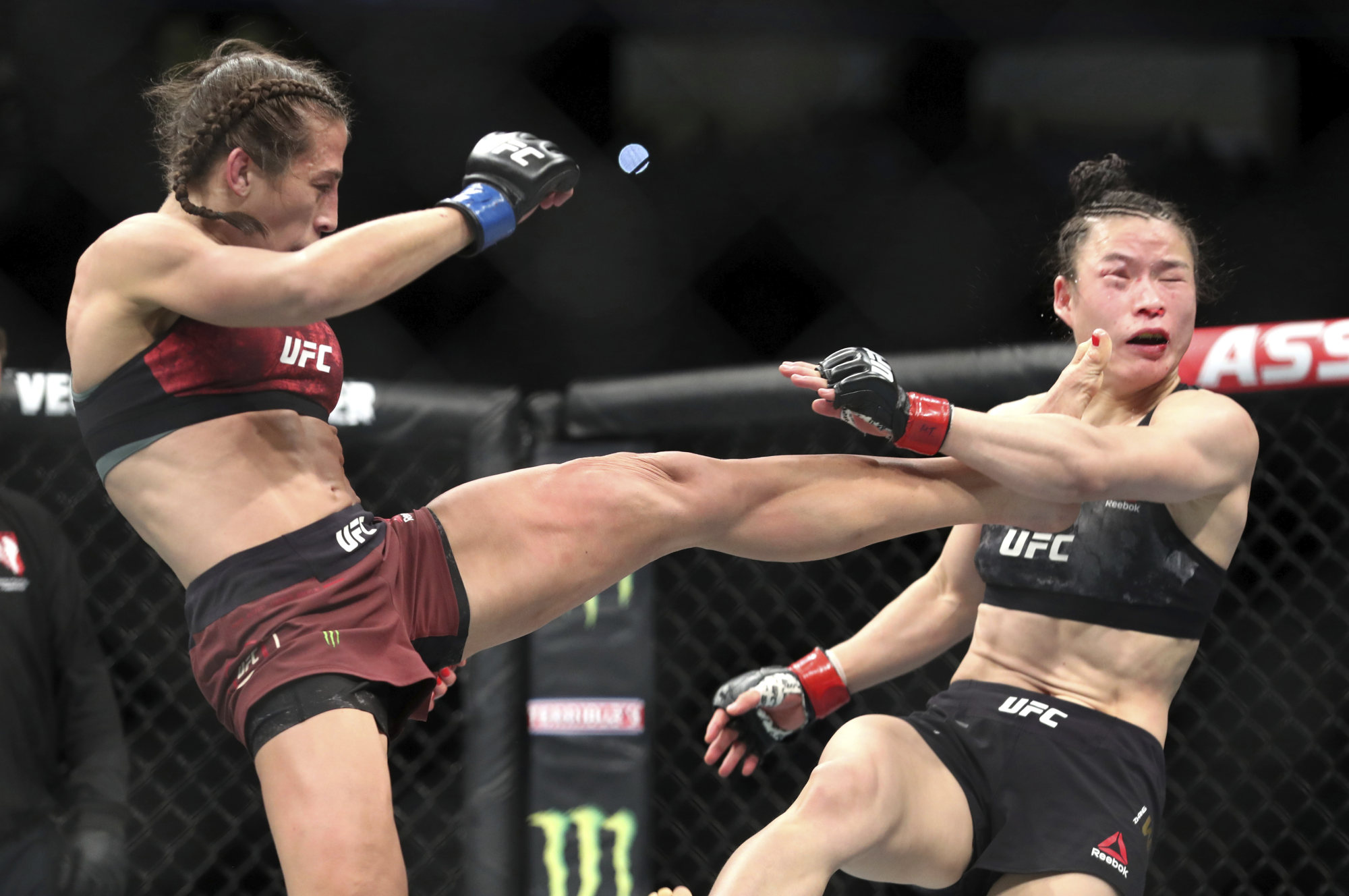 Zhang Weili gets kicked by Joanna Jedrzejczyk at UFC 248 at T-Mobile Arena. Photo: AP
