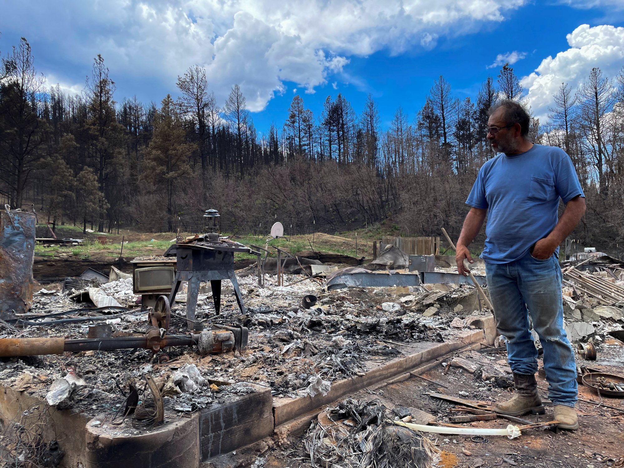 Daniel Encinias stands next to the ruins of his home destroyed by the Hermits Peak Calf Canyon fire in Tierra Monte, New Mexico, US, on Thursday. Photo: Reuters