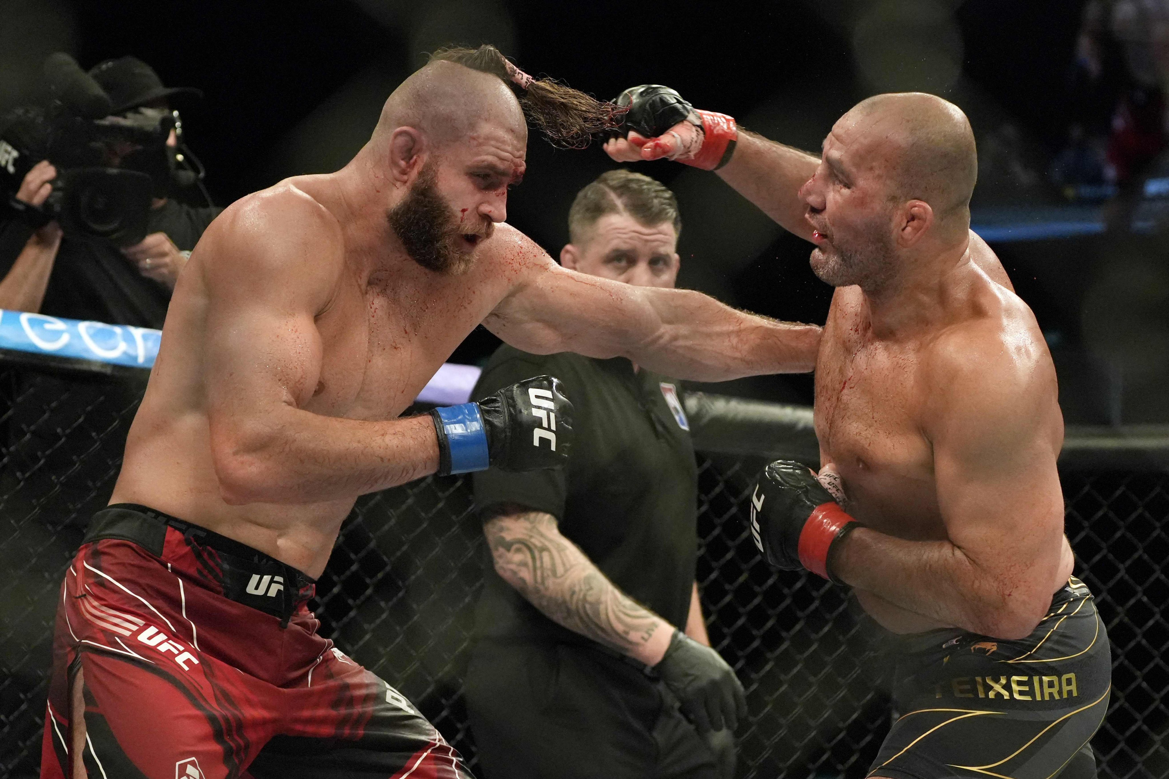 Glover Teixeira trades punches with Jiri Prochazka at UFC 275 in Singapore. Photo: AFP