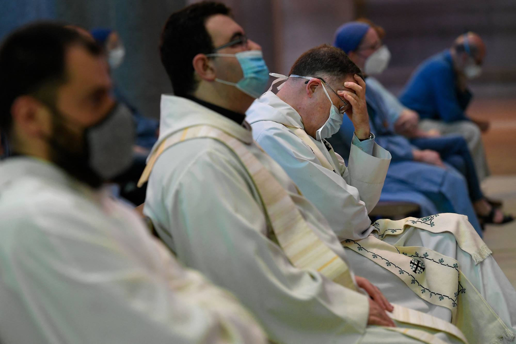 Priests and other members of the religious community attend the celebration of a mass at the Sagrada Familia basilica in Barcelona. Photo: AFP