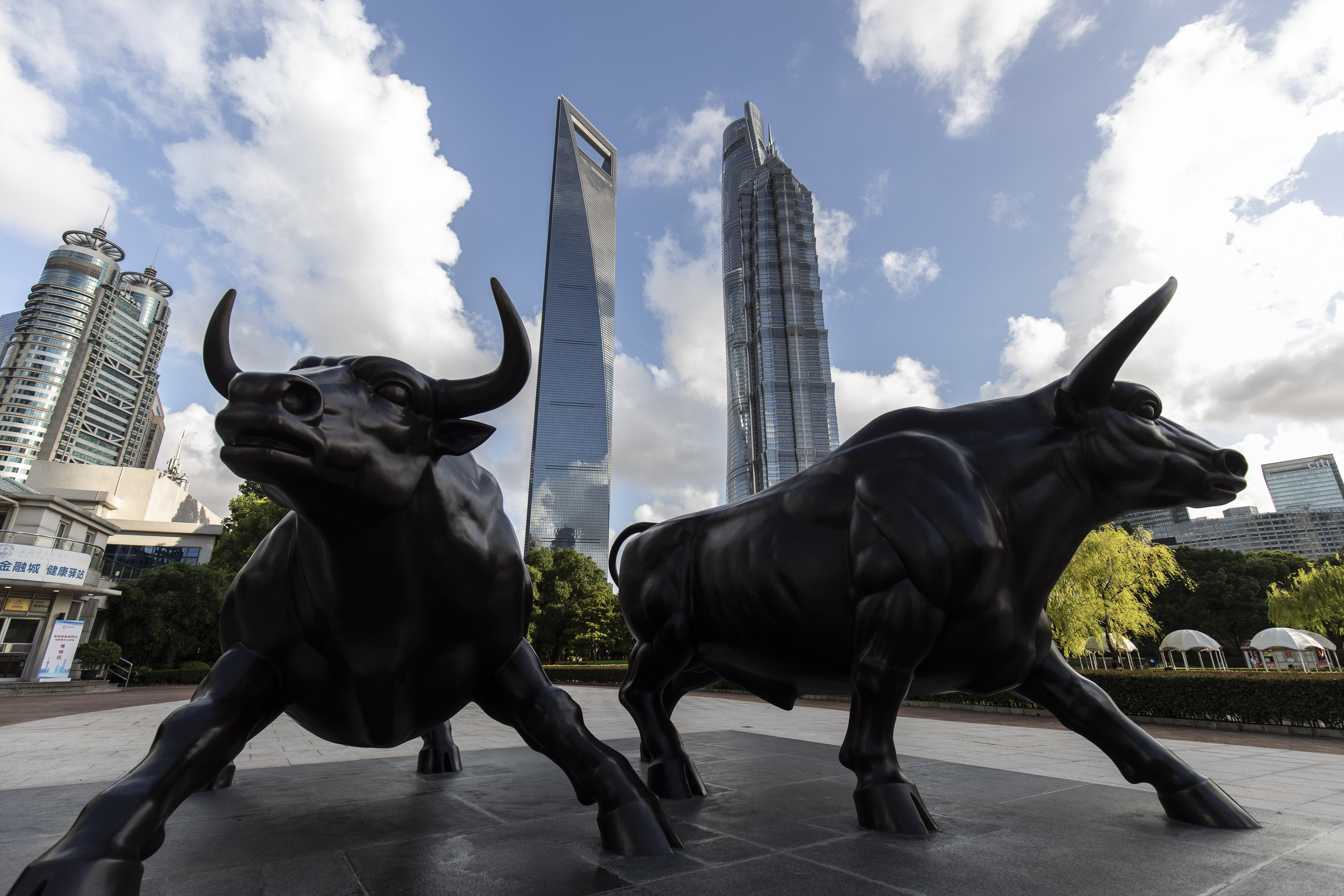 A sculpture of bulls in the Lujiazui business district in Shanghai, China, on Tuesday, July 20, 2021. Banks in China kept the benchmark loan rate unchanged, indicating that the central bank is continuing to keep policy stable despite a recent surprise move to add liquidity to the financial system. Photographer: Qilai Shen/Bloomberg