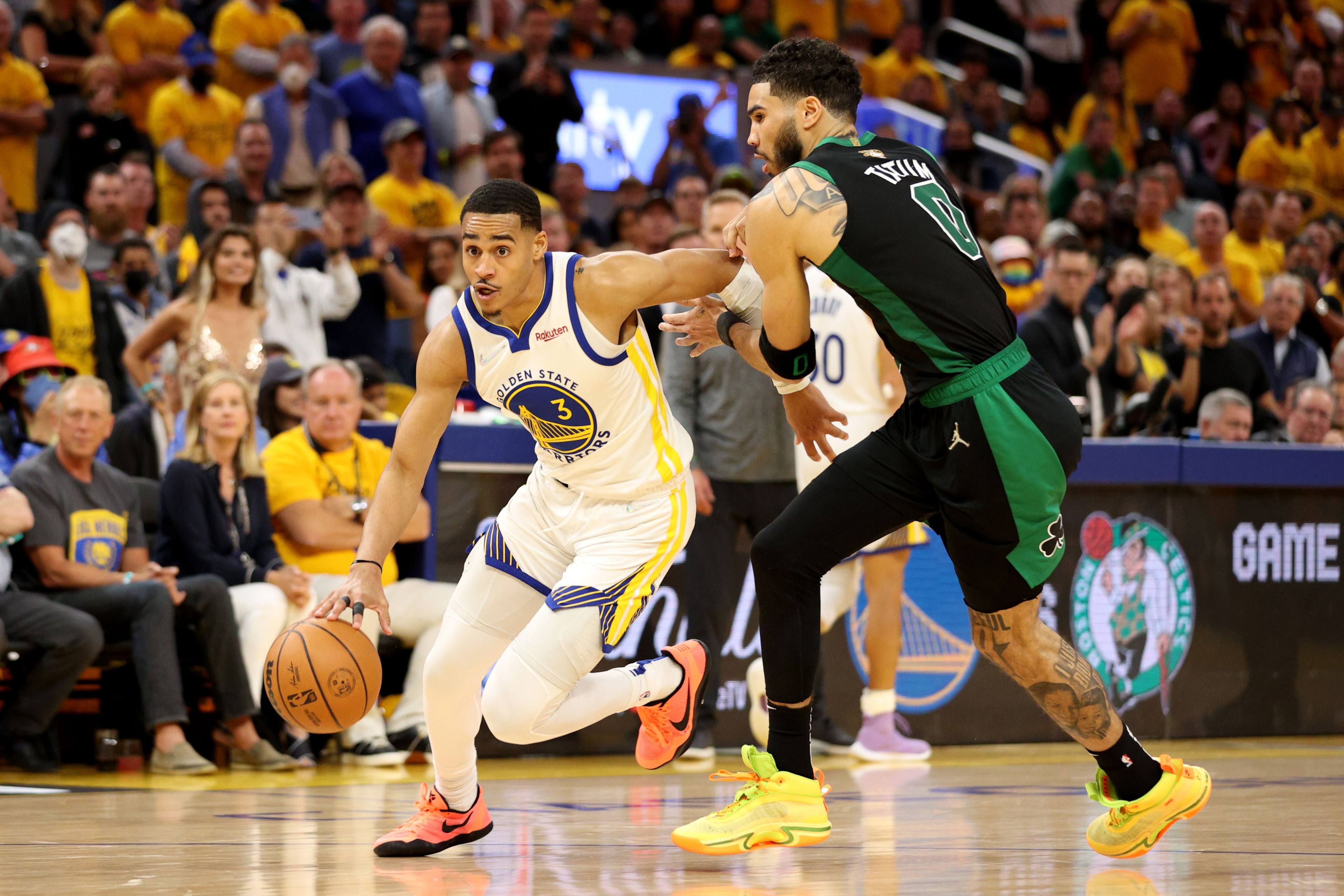 Jordan Poole of the Golden State Warriors drives past Jayson Tatum during the fourth quarter in Game Five of the 2022 NBA Finals. Photo: AFP