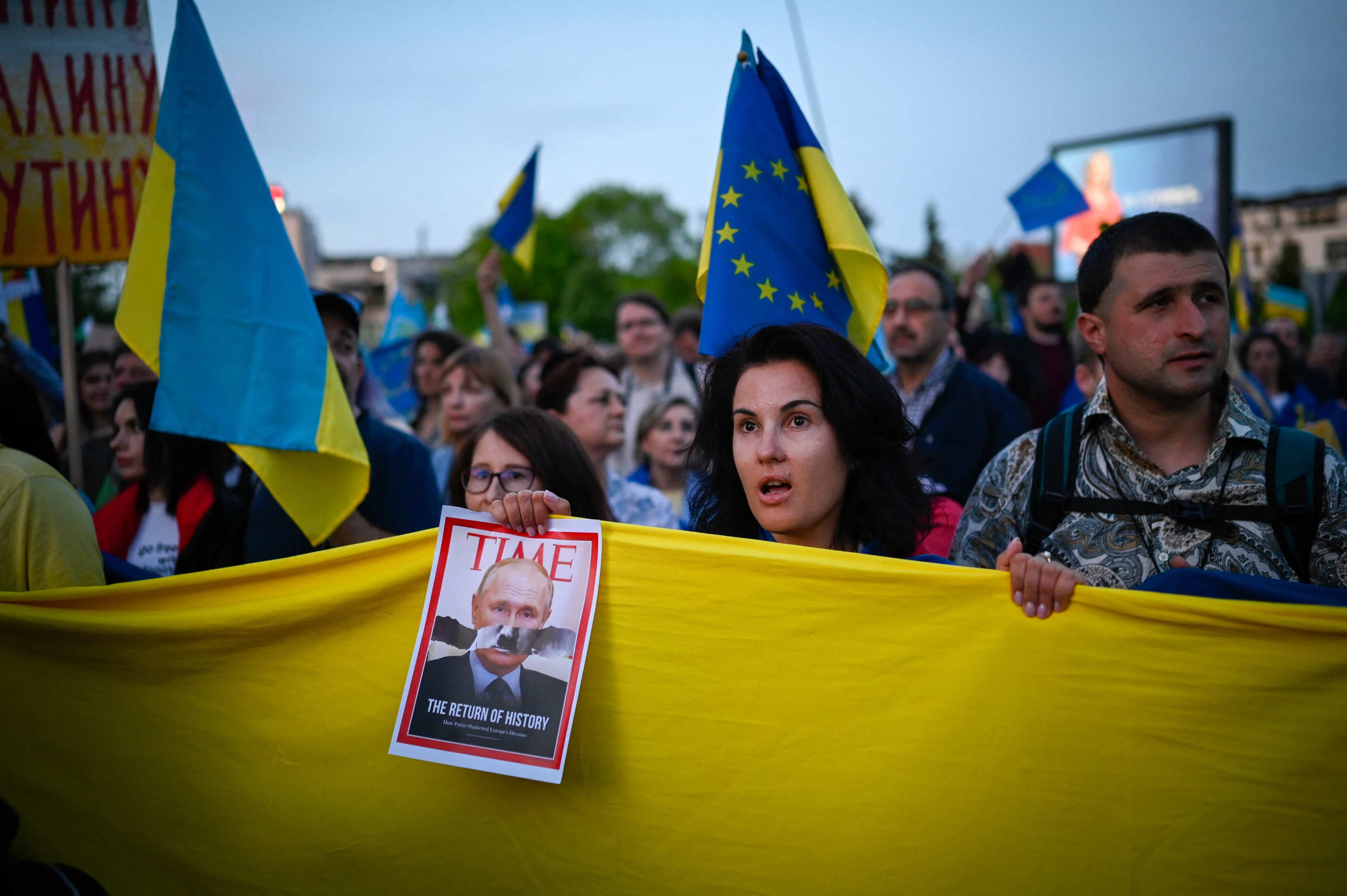 Demonstrators hold the Ukrainian flag during a protest against the Russian invasion of Ukraine, in Sofia, Bulgaria, on May 9. The country, which has historically close ties with Russia, is now split between pro-Russia and pro-Ukraine supporters. Photo: AFP