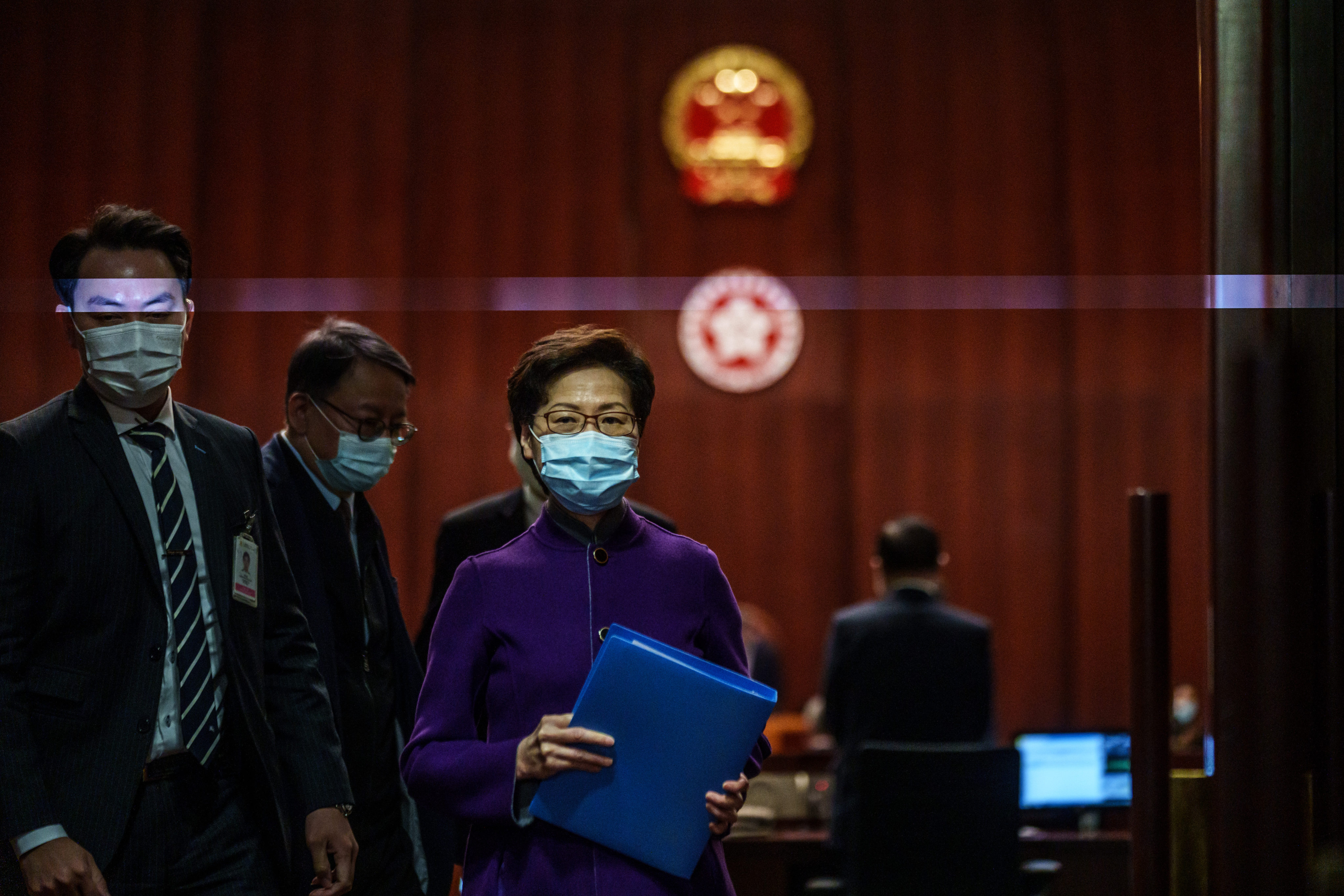 Outgoing Chief Executive Carrie Lam leaves the Legislative Council following a Q&A session on January 12. Photo: Bloomberg